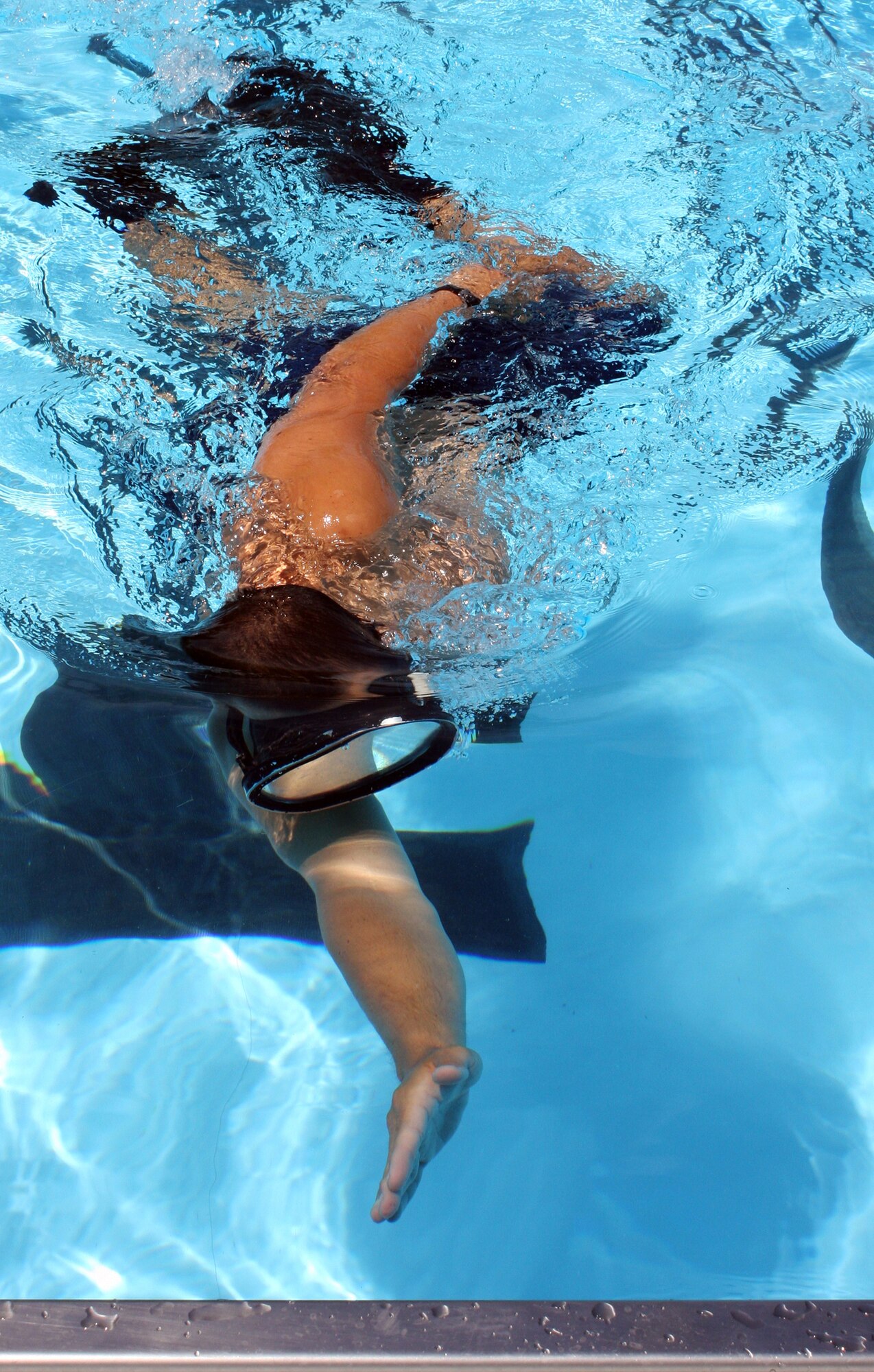 WRIGHT-PATTERSON AIR FORCE BASE, Ohio - Senior Airman Eddie Mulkey, 445th Aeromedical Evacuation Squadron, prepares for his final Air Force Special Operations Command Physical Ability Stamina Test by swimming at the base pool back in July at Wright-Patterson Air Force Base, Ohio. Sergeant Mulkey found out in August that he was selected to join the USAF Pararescuemen. (U.S. Air Force photo/Staff Sgt. Robert Nelson)