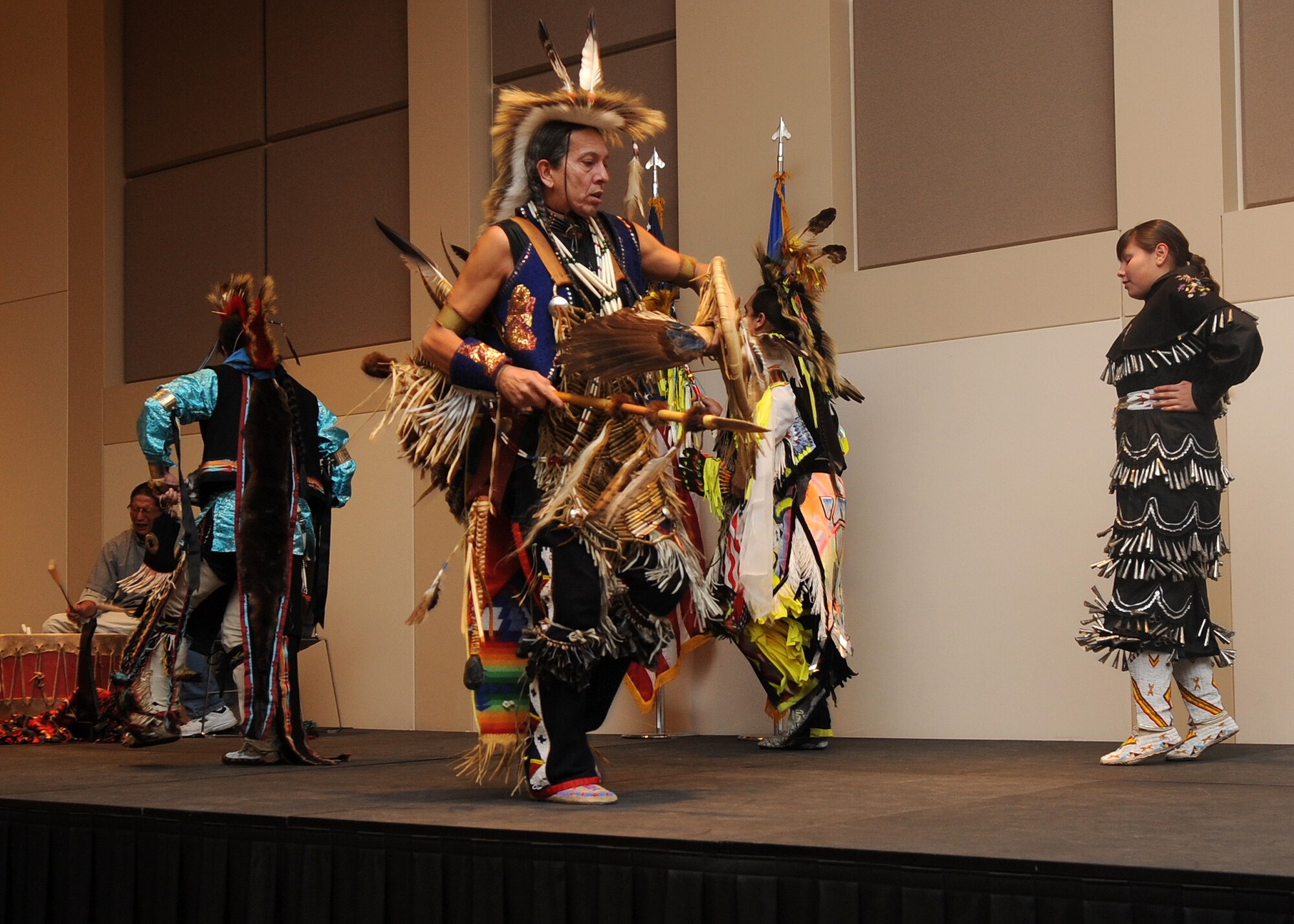 Buckley Air Force Base, Colo.-  Dancers from the Denver Indian Center perform the "Crow Hop". Members of different tribes performed this intertribal dance together. ( U.S. Air Force Photo by Airman 1st Class Marcy Glass )
