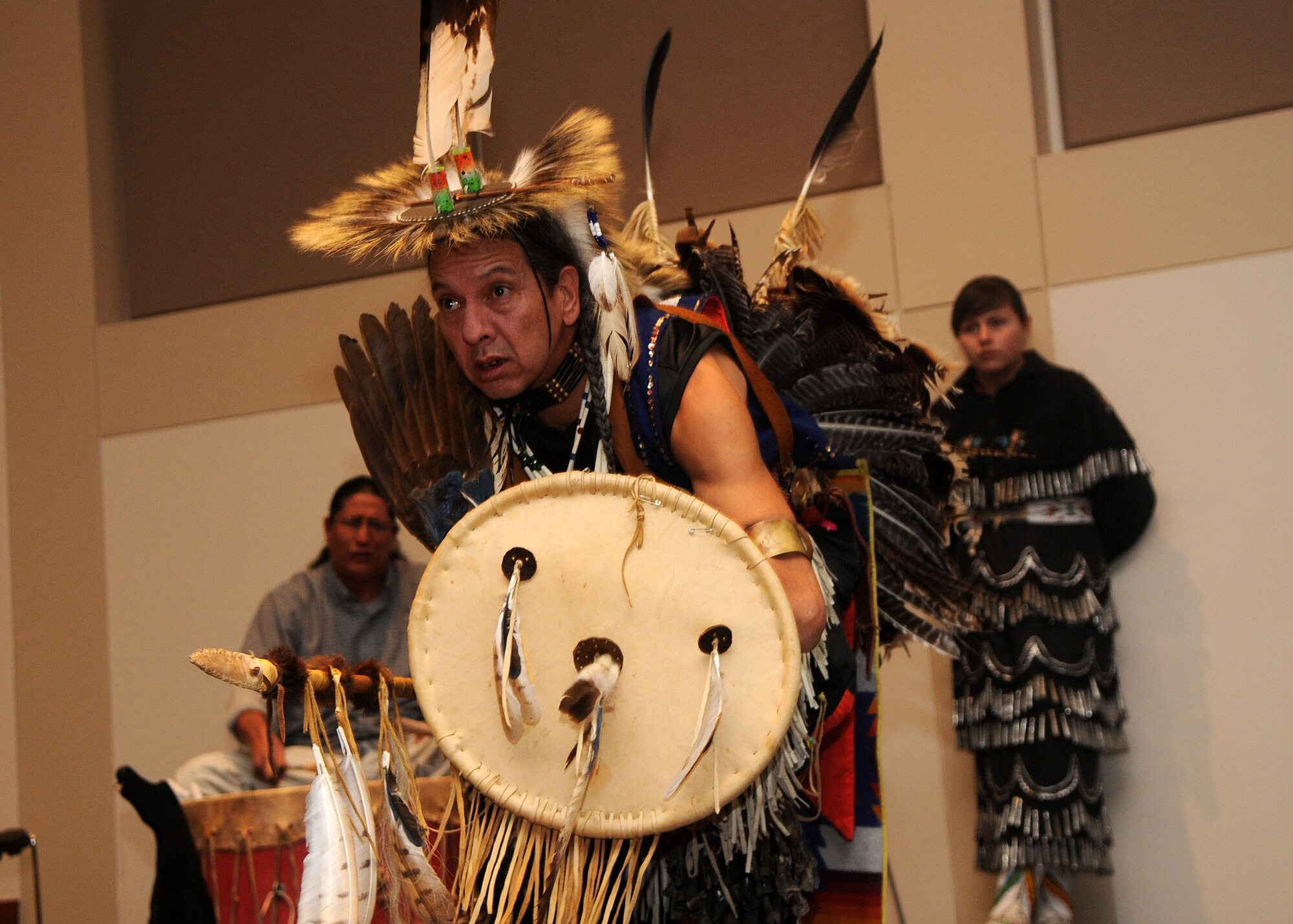 Buckley Air Force Base, Colo.-  A dancer from the Denver Indian Center dances to the "Sneak Up Song"  performed  by the drummers depicting the tribe working together in tactical ways to sneak up on their enemies. ( U.S. Air Force Photo by Airman 1st Class Marcy Glass )