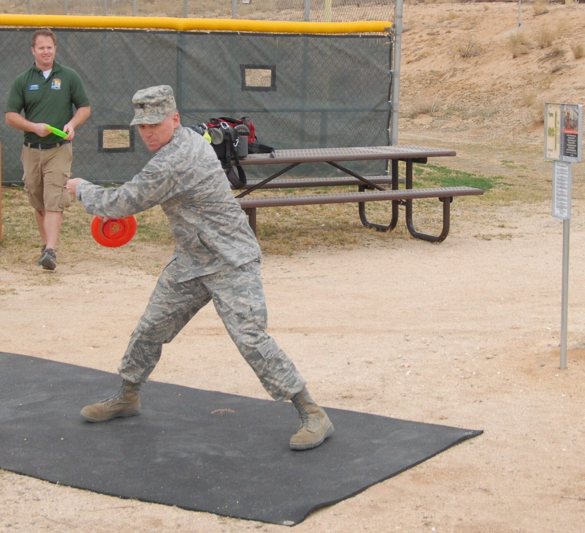 Col. Harry Berry, 95th Mission Support Group commander, throws out the first official disc at Edwards’ new disc golf course, Nov. 19.  Colonel Berry cut the ceremonial ribbon beforehand to open up the nine-hole course.  (Air Force photo by Kenji Thuloweit)