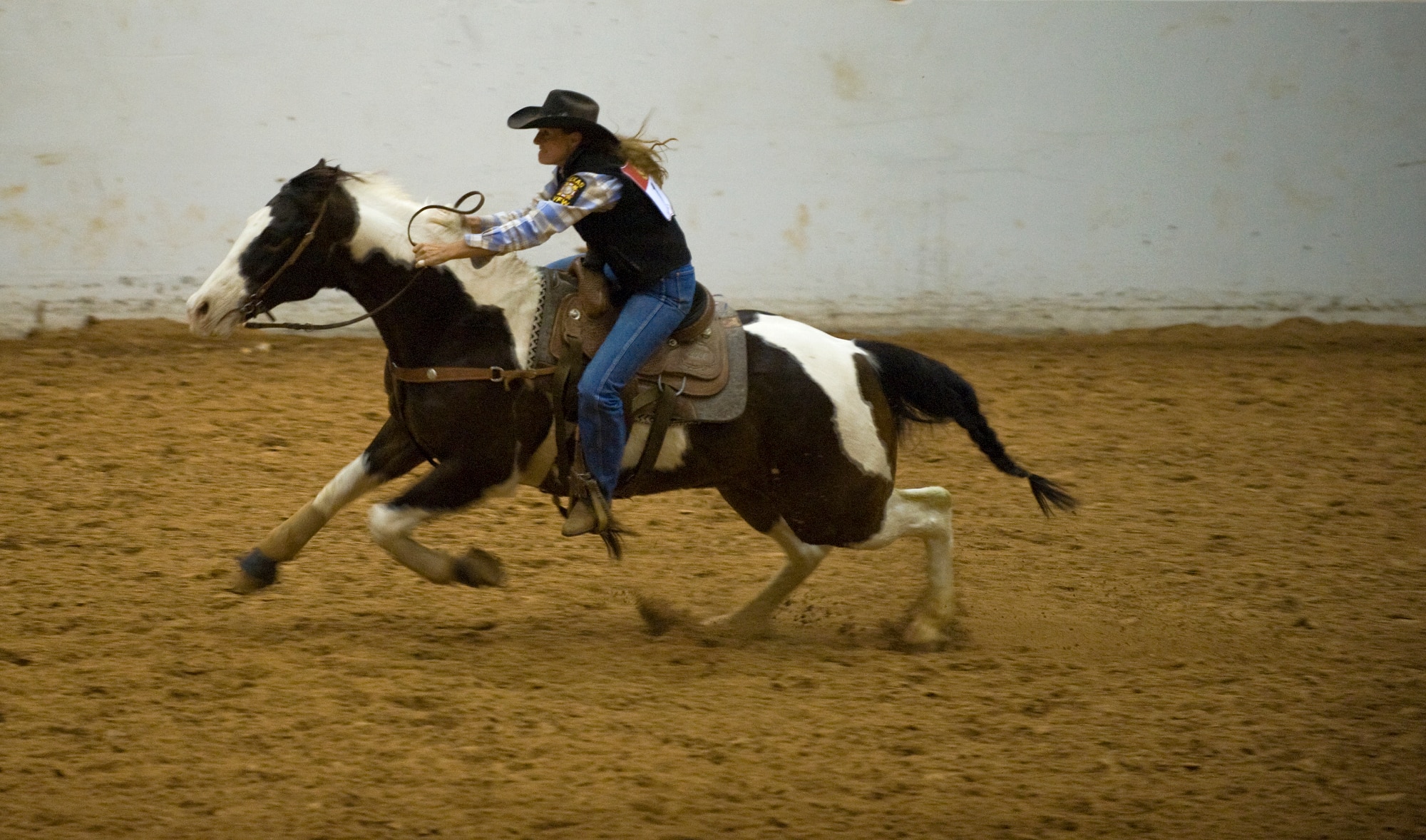 Lt. Col. Val Baker races to the finish line during the timed barrel racing competition at the Professional Armed Forces Rodeo Associations World Finals Nov. 20, 2010, in Glen Rose, Texas. Colonel Baker earned first place in the Woman's All-Around winning top honors in the rodeo while competing in five events. (U.S. Air Force photo/Tech. Sgt. Bennie J. Davis III)