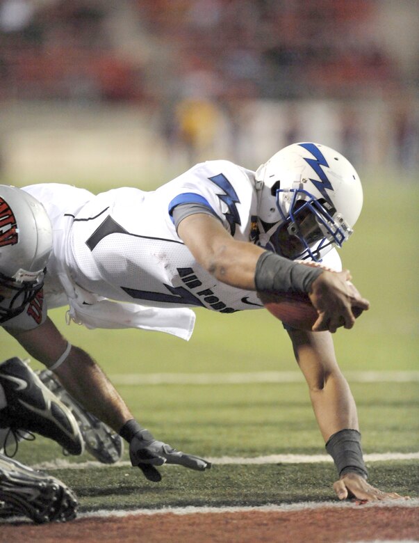 Air Force quarterback Tim Jefferson dives into the end zone for a touchdown in the Falcons' final game of the regular season against the University of Nevada, Las Vegas Nov. 18, 2010, in Las Vegas. Jefferson threw for 111 yards and ran for 64, scoring three rushing touchdowns to lead the Falcons to a 35-20 victory over the Rebels. (U.S. Air Force photo/Airman 1st Class Daniel Hughes)
