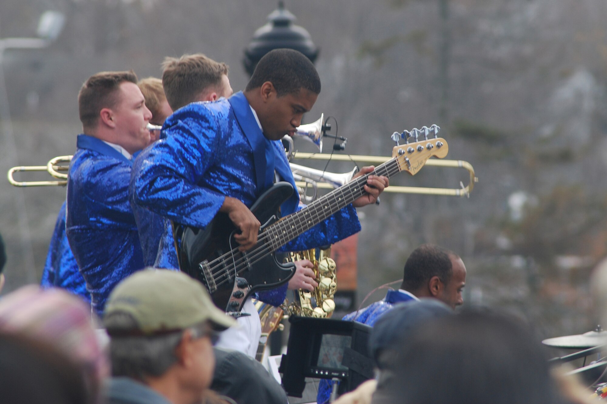 Airman First Class Samuel Underwood plays bass for the Air Force talent band Tops in Blue during America's Hometown Thanksgiving Parade Nov. 20 in Plymouth, Mass.  Shortly after the performance, a C-5 from Westover performed a flyby for the crowd of more than 175,000. (US Air Force photo/Lt. Col. James Bishop)
