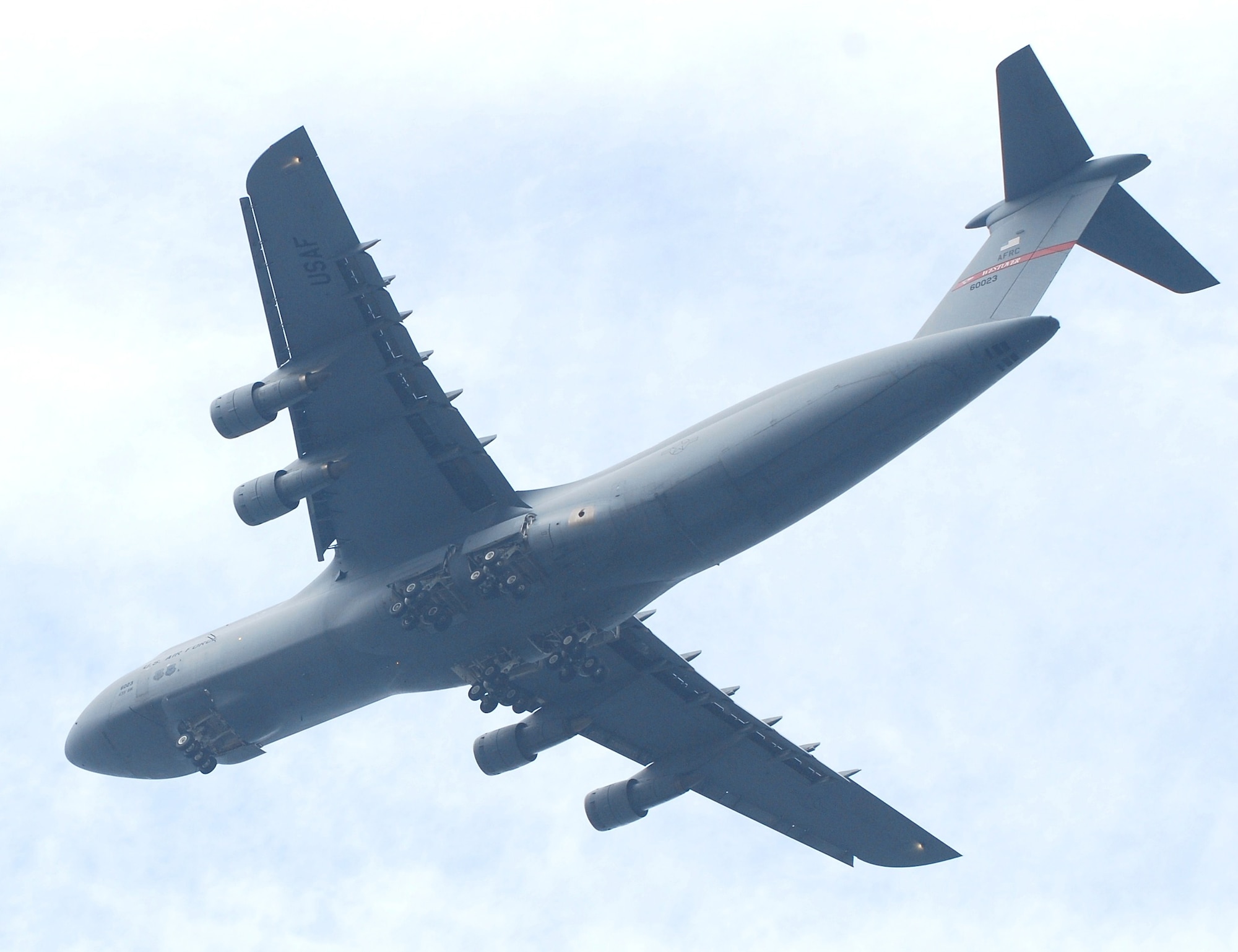 A C-5B from Westover performs a flyover to kick off America's Hometown Thanksgiving Parade Nov. 20 in Plymouth, Mass. The aircraft flew a "positioning leg" up the Plymouth, Mass., coastline to the delight of a crowd that topped 175,000. The annual event is billed as the second largest Thanksgiving Day Parade in the country, according to event organizers. (US Air Force photo/Lt. Col. James Bishop)
