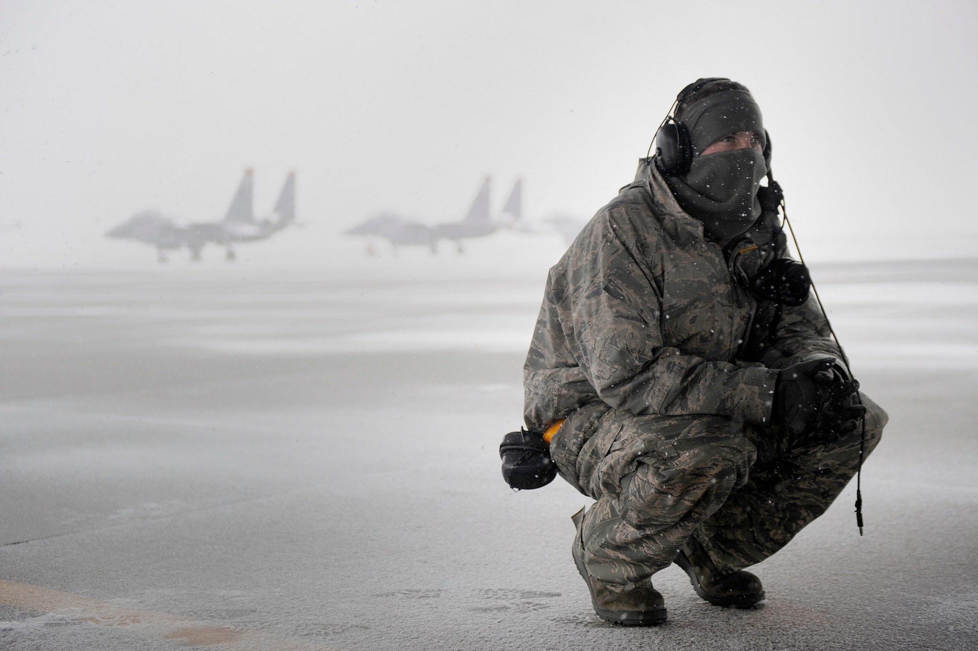 Senior Airman Stephen Held takes a break during an exercise Nov. 21, 2010, on the flightline at Mountain Home Air Force Base, Idaho. Wing officials use operational readiness exercises to gauge the wing's ability to meet wartime taskings at a deployed location. The evaluation includes initial response, readiness, combat operations, ability to survive and operate, self aid and buddy care, and mission support. Airman Held is assigned to the 391st Fighter Squadron as a crew chief. (U.S. Air Force photo/Senior Airman Renishia Richardson) 