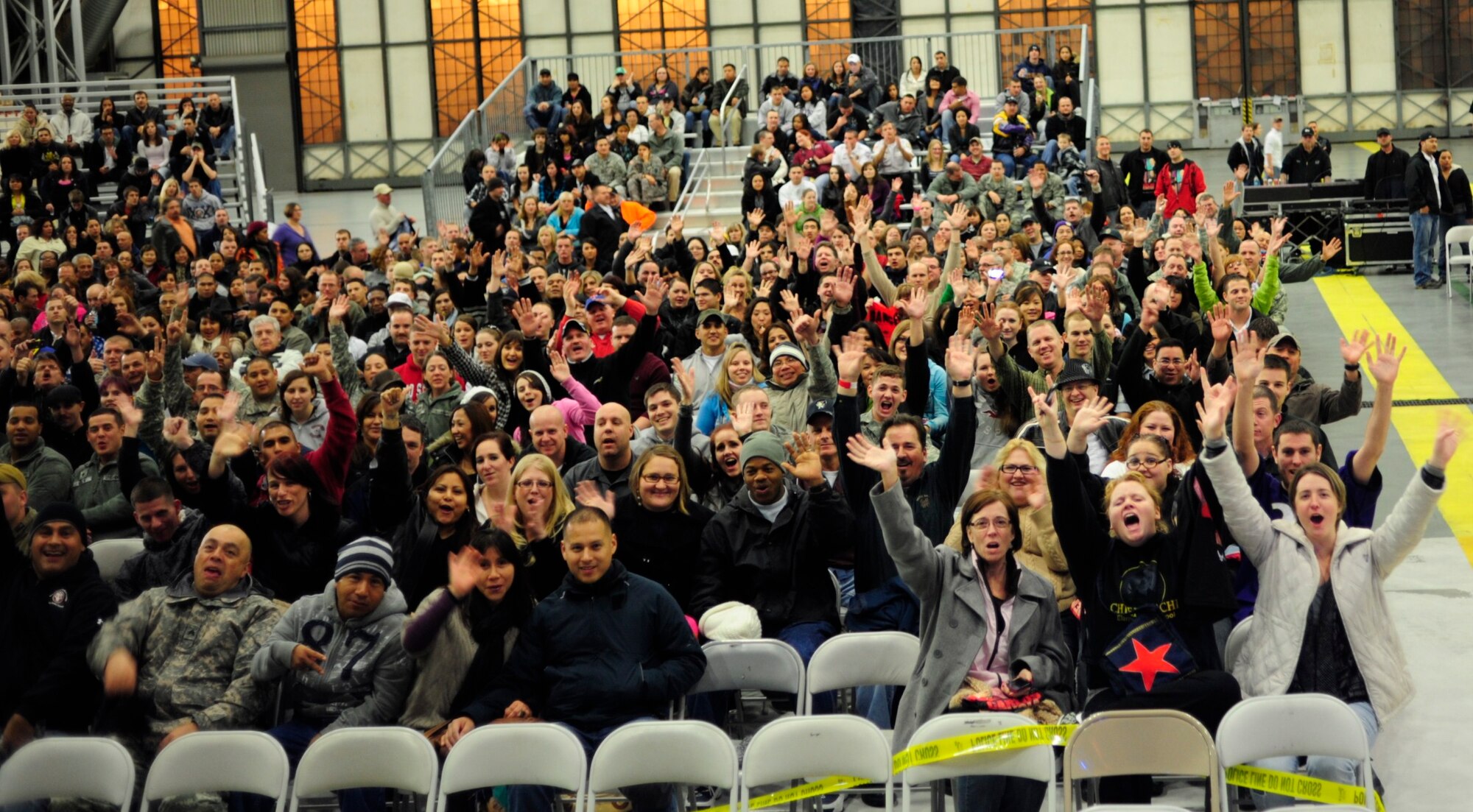 The crowd of more than 2,000 fans anxiously awaits the comedic performance of Carlos Mencia, the man behind Comedy Central's popular "Mind of Mencia" television program, Nov. 19. at McChord Field, Joint Base Lewis-McChord, Wash. (U.S. Air Force photo/Airman Leah Young)