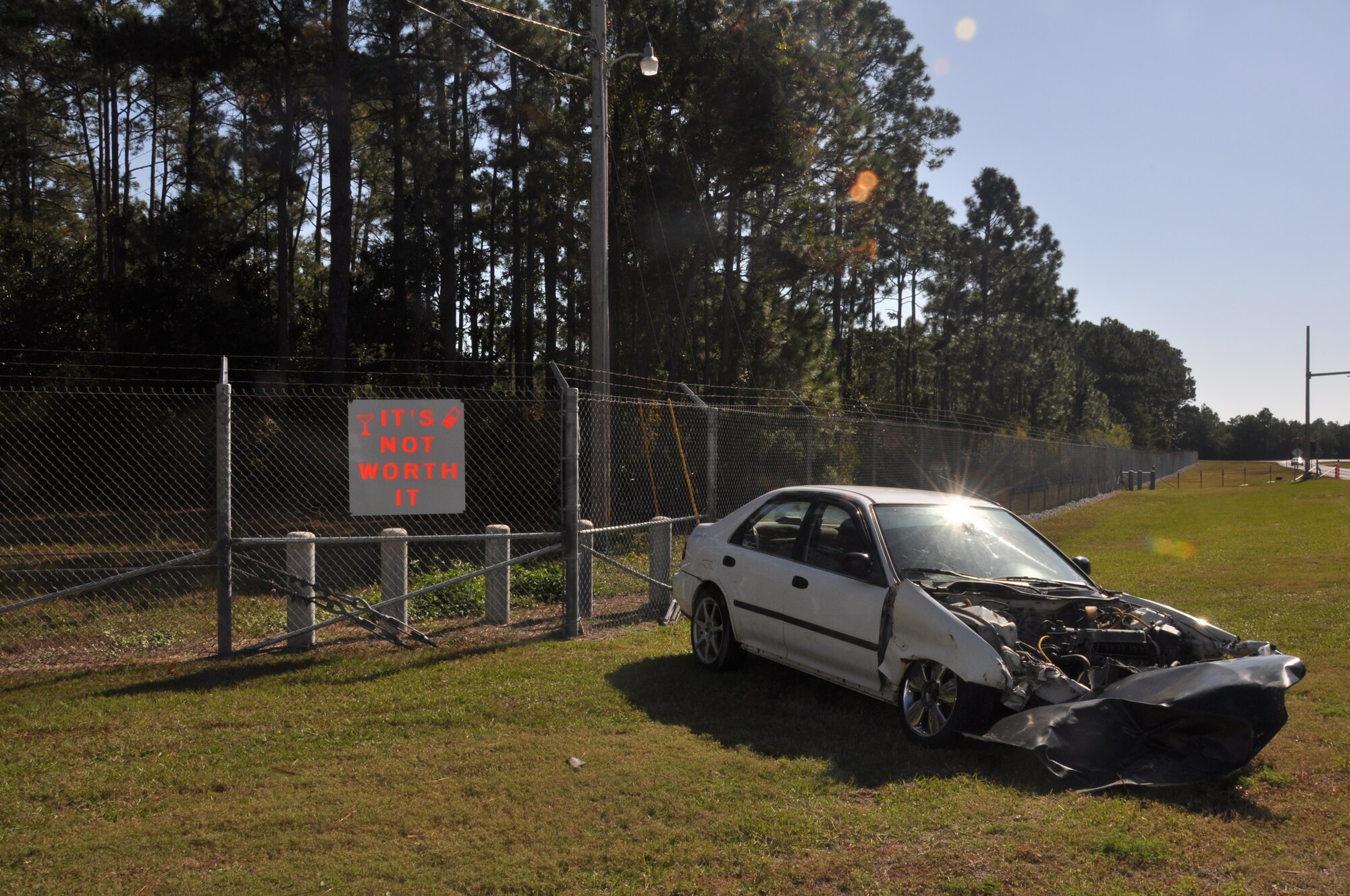 A wrecked vehicle is being displayed at Tyndall's Sabre Gate to remind Team Tyndall to be safe during the holidays.  (U.S. Air Force photo/2nd Lt. Melanie Holliday)