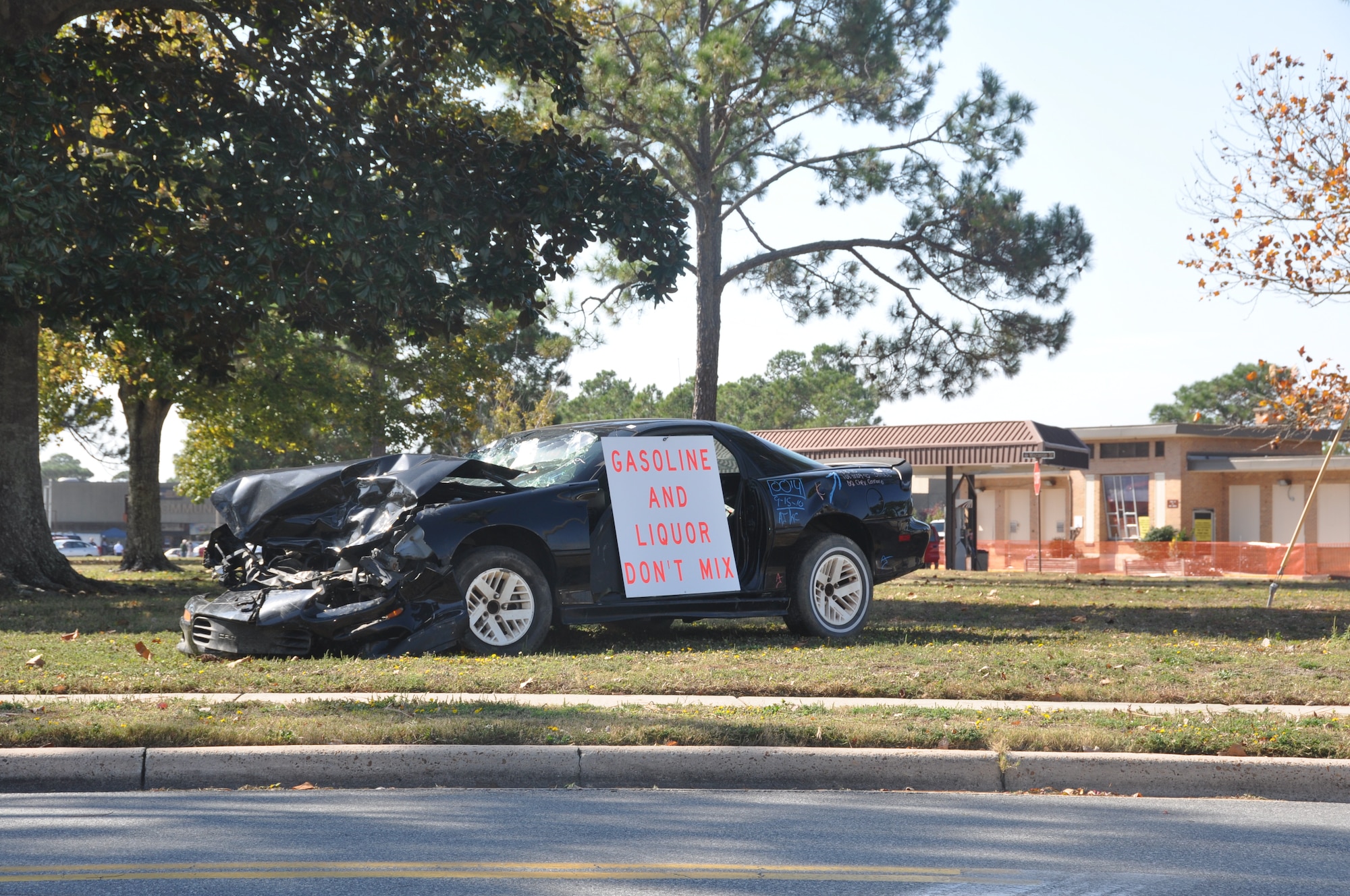 A wrecked vehicle is being displayed at Tyndall's Main Gate to remind Team Tyndall to be safe during the holidays.  (U.S. Air Force photo/2nd Lt. Melanie Holliday)