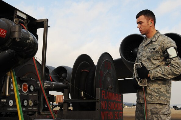 Airman 1st Class Johnny Bippert, 2nd Logistics Readiness Squadron fuels operator, uses a R-14 fueling truck to refuel a B-52H Stratofortress at Barksdale Air Force Base, La., Nov. 22. The 2 LRS manages all supply, equipment and fuels requisitions, supply programs, policies and procedures and stock fund support for the 2nd Bomb Wing. (U.S. Air Force photo/Senior Airman Brittany Y. Bateman)(RELEASED)
