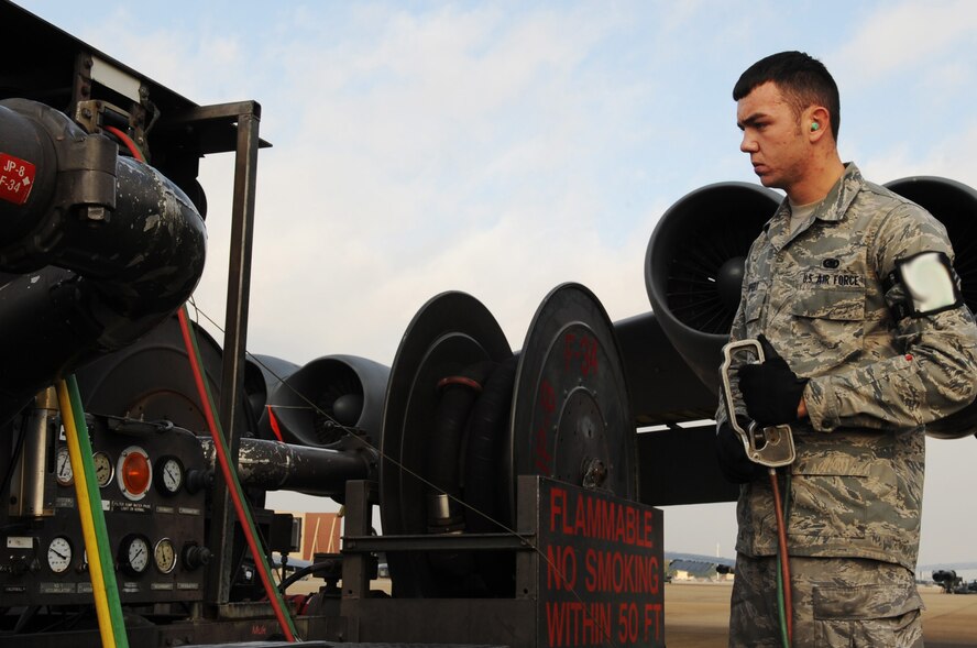 Airman 1st Class Johnny Bippert, 2nd Logistics Readiness Squadron fuels operator, uses a R-14 fueling truck to refuel a B-52H Stratofortress at Barksdale Air Force Base, La., Nov. 22. The 2 LRS manages all supply, equipment and fuels requisitions, supply programs, policies and procedures and stock fund support for the 2nd Bomb Wing. (U.S. Air Force photo/Senior Airman Brittany Y. Bateman)(RELEASED)
