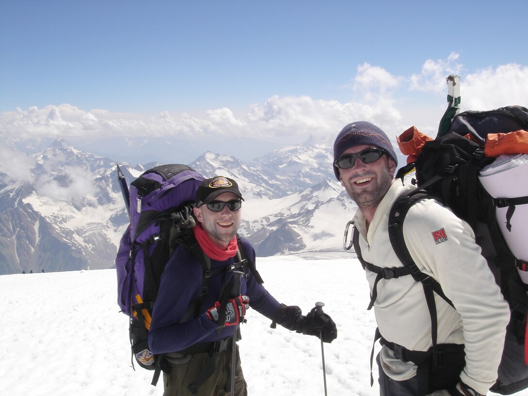 Capt. Rob Marshall prepares to ski down from the summit of Mt. Elbrus, the highest peak in Russia, with fellow Airman and mountaineer Capt. Mark Uberuaga, now with the 55th Rescue Squadron, Davis-Monthan Air Force Base, Ariz., after completing their first climb as part of the U.S. Air Force Seven Summits Challenge in July 2005. The U.S. Air Force Seven Summits Challenge is an endeavor for Air Force members to carry the Air Force flag to the highest point on each continent and to be the first U.S. military group to conquer all seven peaks. Captain Marshall is a member of the 8th Special Operations Squadron at Hurlburt Field, Fla. (Courtesy photo)
