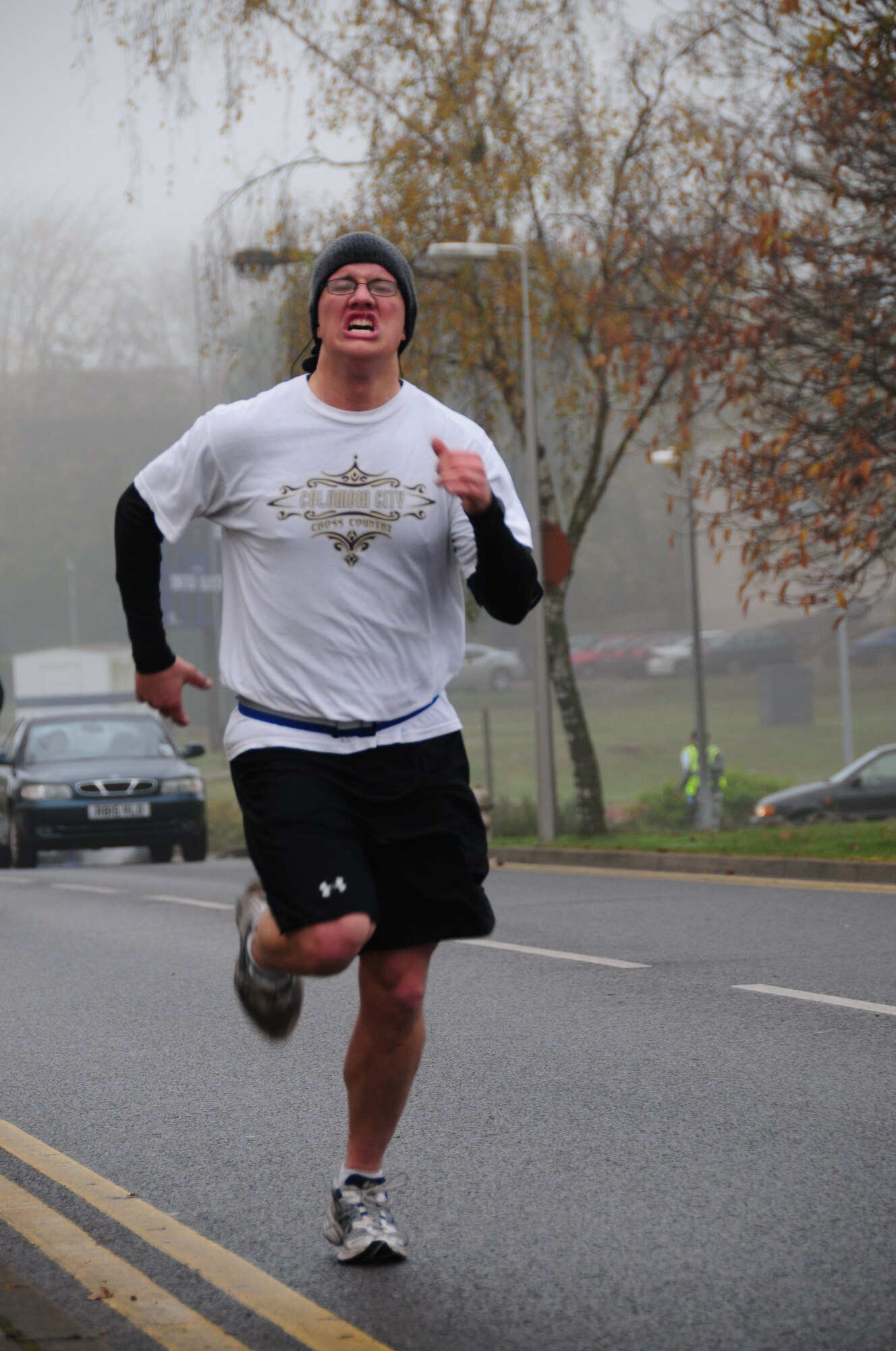 ROYAL AIR FORCE LAKENHEATH, England – Airman 1st Class William Delaney, 48th Logistics Readiness Squadron fuels craftsman, sprints to the finish line for a time of 18 minutes, 54 seconds at the 2010 Turkey Trot on Nov. 20. Airman Delaney won 2nd place in the adult male category in the annual 5k fun run. The first and second place winners from the three categories received their choice of a turkey or pie.  (U.S. Air Force photo/Senior Airman Stephen Linch)