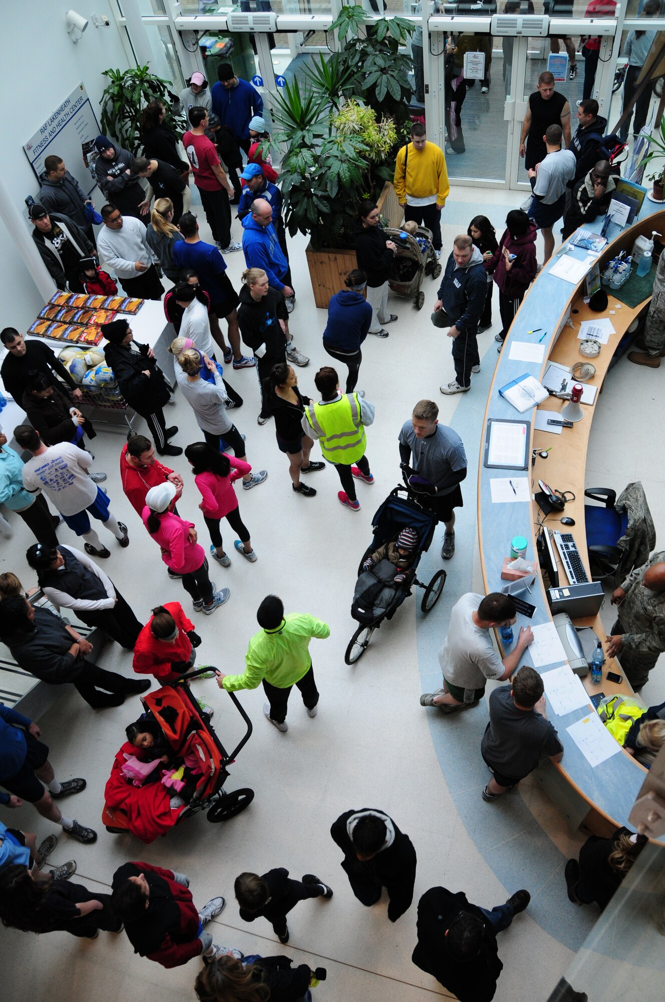 ROYAL AIR FORCE LAKENHEATH, England – Team Lakenheath members wait inside the fitness center for the start of the 2010 Turkey Trot on Nov. 20. The annual 5K fun run had 116 participants with the first 50 to cross the finish line receiving T-shirts provided by the Airman and Family Readiness Center. (U.S. Air Force photo/Senior Airman Stephen Linch)