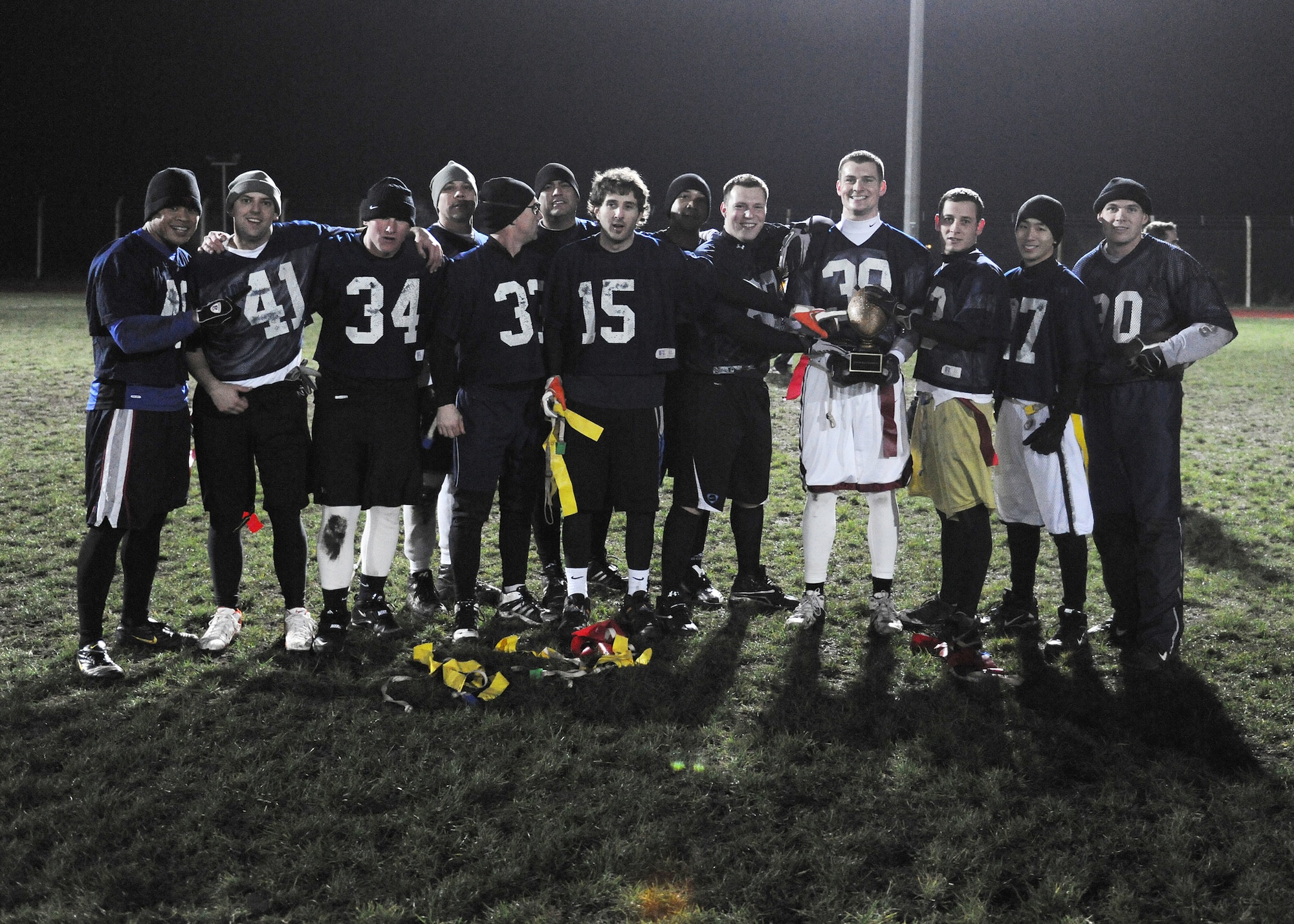RAF MILDENHALL, England -- The 488th Intelligence Squadron receives a trophy here Nov. 18, 2010, after the intramural football championship.  The 488th IS beat the 100th Operations Group, 12-6.  Intramural football, organized by the 100th Force Support Squadron fitness staff, helps build the moral of base members.  (U.S. Air Force photo/Senior Airman Tabitha M. Lee)