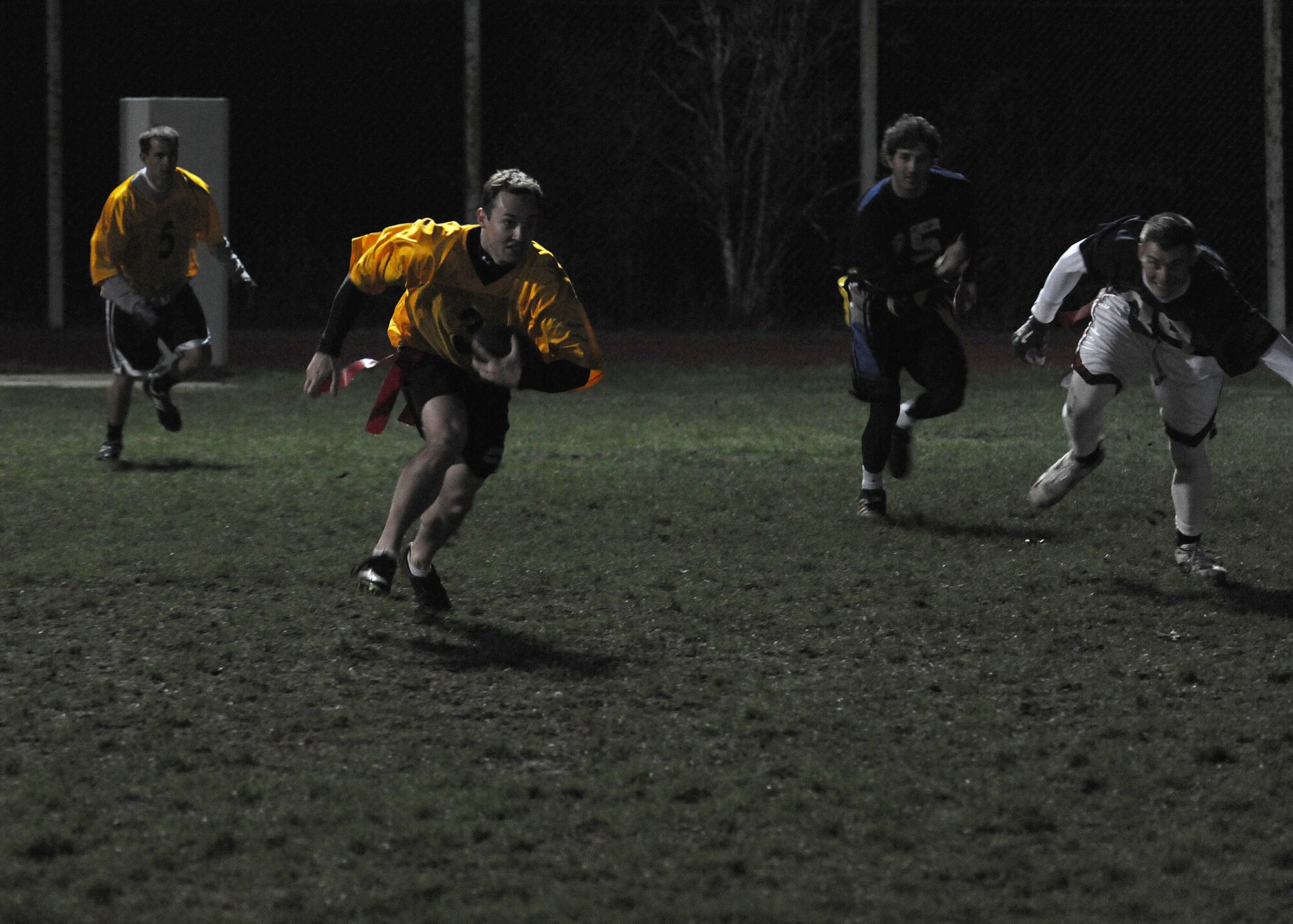 RAF MILDENHALL, England -- Peter McGavin, 351st Air Refuelling Squadron, runs the ball here Nov. 18, 2010, during the intramural football championship.  The 488th Intelligence Squadron beat the 100th OG, 12-6.  Intramural football, organized by the 100th Force Support Squadron fitness staff, helps build the moral of base members.  (U.S. Air Force photo/Senior Airman Tabitha M. Lee)