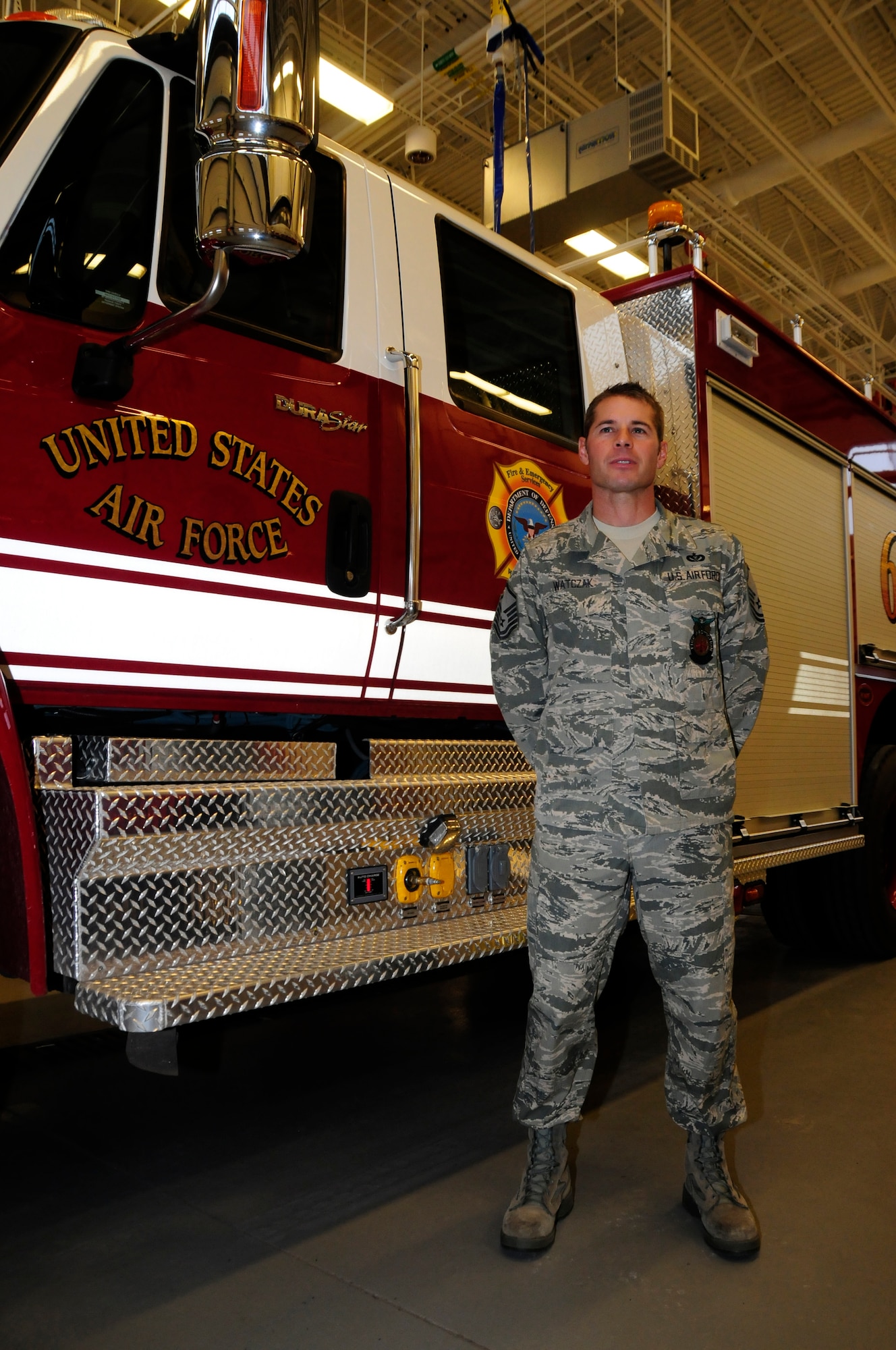 U.S. Air Force Master Sgt. Mark Watczak, Assistant Fire Chief of the 148th Fighter Wing, Minnesota Air National Guard, stands in front of a medium rescue truck while being interviewed at the Duluth, Minn. Air National Guard base Nov. 20, 2010 . Watczak, a 20 year veteran of the 148th FW, was recently recognized as Military Fire Fighter of the Year and presented with "The Chief Albert Fitzpatrick Award." (U.S. Air Force photo by Senior Airman Sarah C. Hayes/Released)
