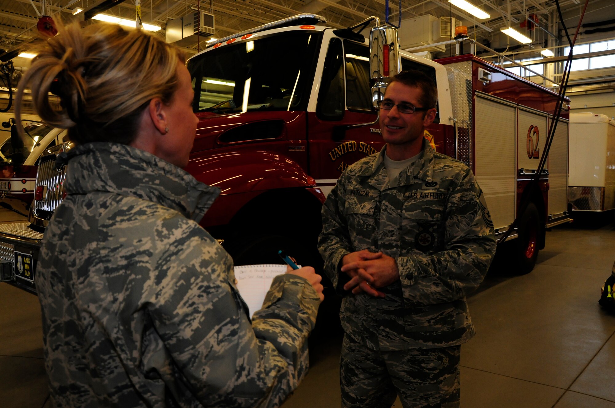 2nd Lt. Jodi Kiminski interviews Master Sgt. Mark Watczak, Assistant Fire Chief of the 148 Fighter Wing on Nov. 20, 2010. Watczak, a 20 year veteran of the 148th FW, was recently recognized as Military Fire Fighter of the Year and presented with "The Chief Albert Fitzpatrick Award." (U.S. Air Force photo by Senior Airman Sarah C. Hayes)