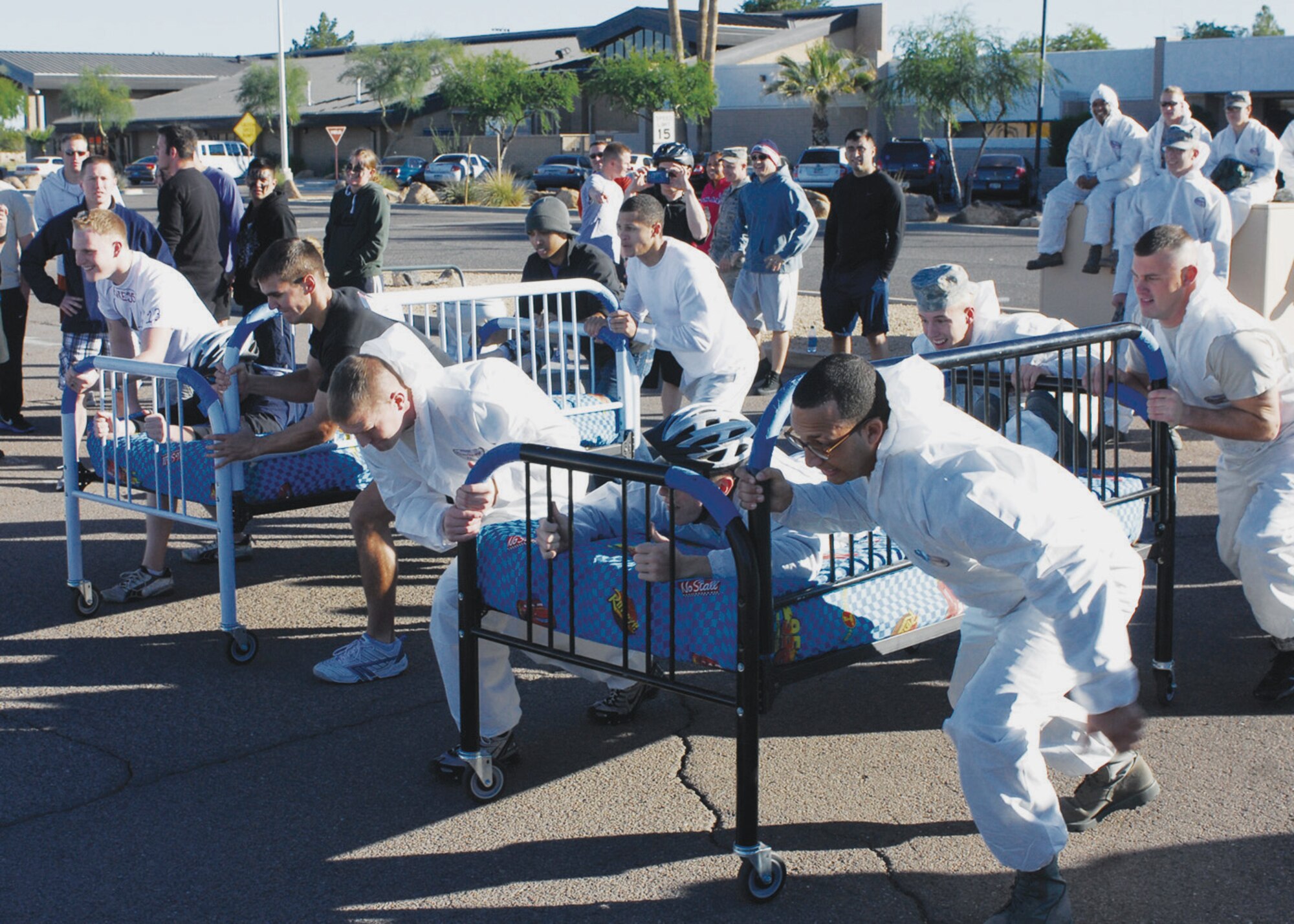 Participants at the Wacky Olympics prepare to start the bed race November 12th in the parking lot on the corner of 137th Avenue located on Luke Air Force Base, Arizona.  (U.S. Air Force photo/Staff Sgt. Louis Vega Jr.)