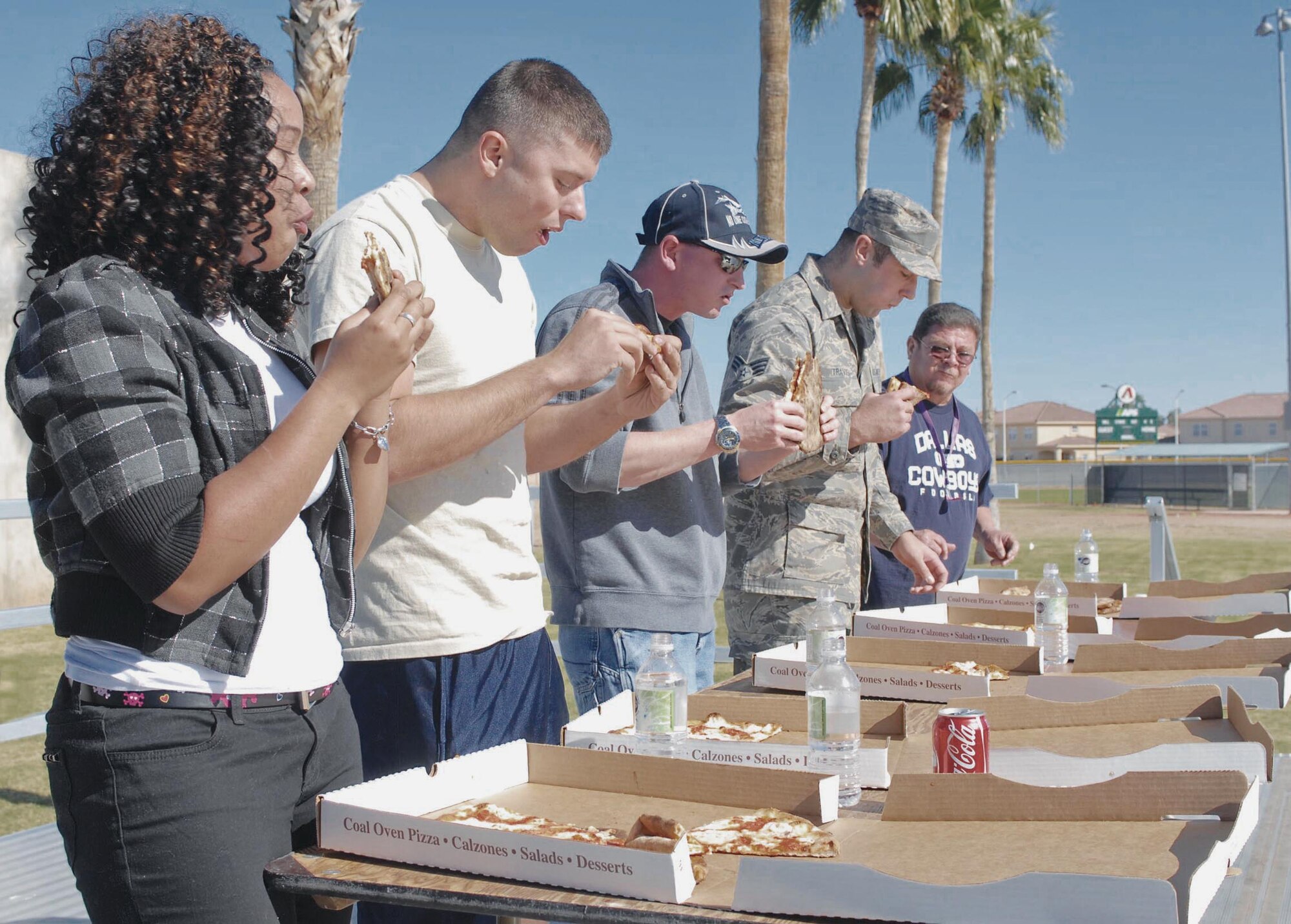 Thunderbolts participate in a pizza eating contest November 12th during the 56th Fighter Wing annual base picnic at Fowler Park.  (U.S. Air Force photo/Senior Airman Darlene Seltmann)