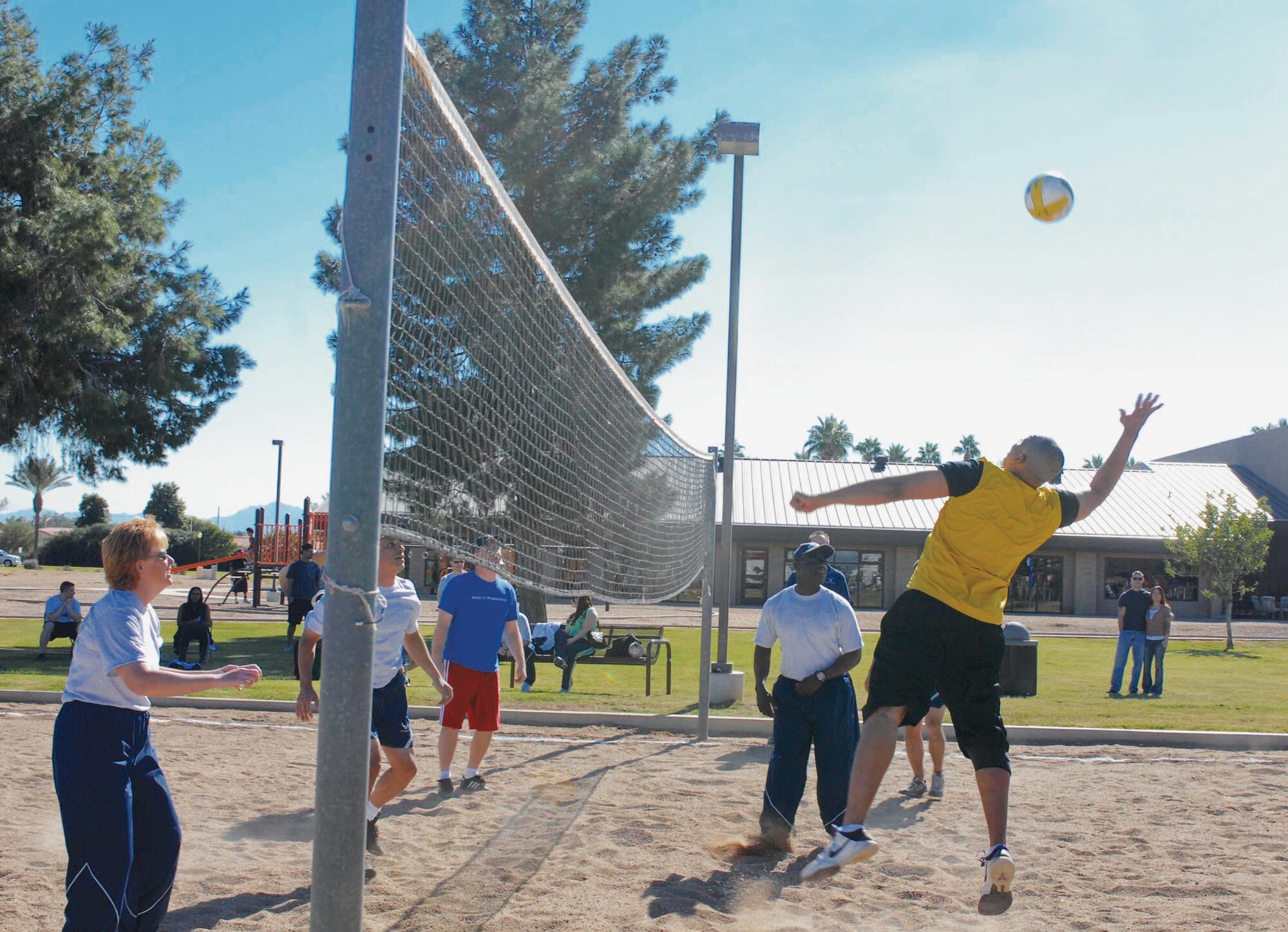 Chief Master Sgt. Kerry Taylor, 56th Civil Engineer Squadron, spikes the ball on November 12th during a Chiefs versus Eagles volleyball game at the Luke base picnic.  (U.S. Air Force photo/Senior Airman Darlene Seltmann)