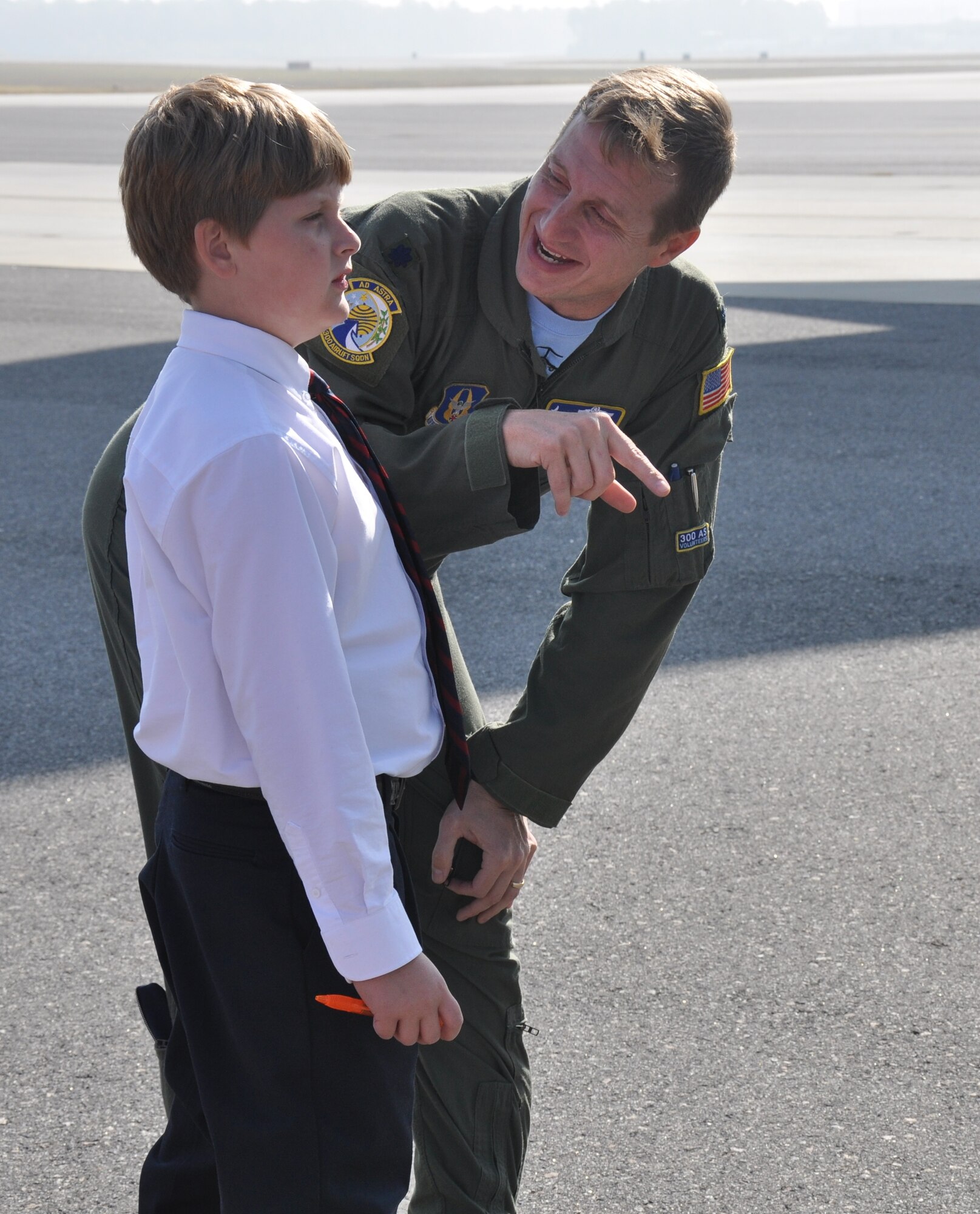 Lt. Col. John B. Gurrieri, a pilot with the 300th Airlift Squadron, explains details of a C-17 Globemaster III aircraft to a student from The Charleston Catholic School during their tour of Joint Base Charleston, S.C. Nov. 19, 2010. (U.S. Air Force photo/Airman 1st Class Robert Pilch)