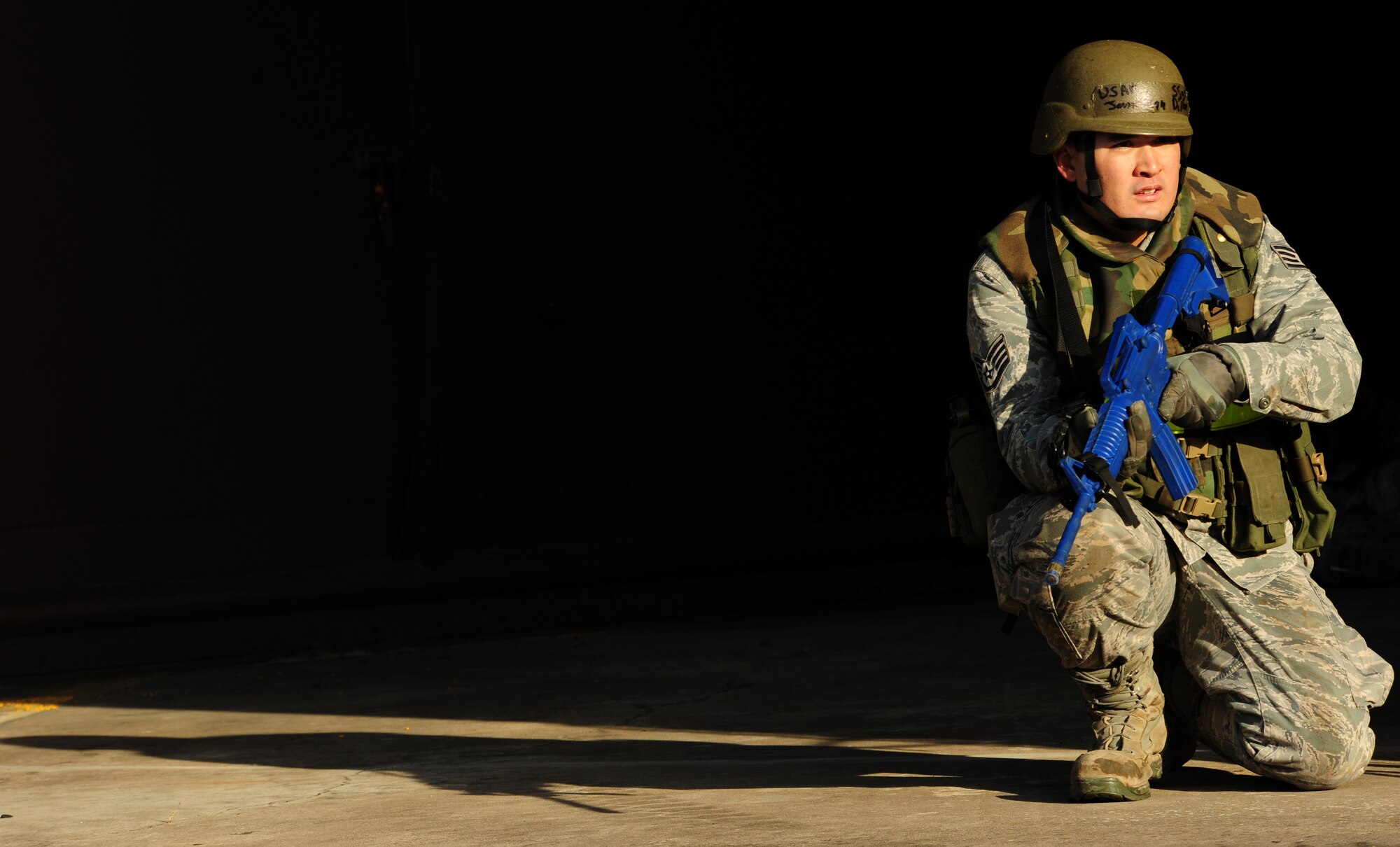 U.S. Air Force Staff Sgt. Jonathan Dillon, 442 Civil Engineer Squadron, Whiteman AFB, takes a defensive stance after a simulated attach during a practical application portion of Silver Flag, Ramstein Air Base, Germany, Nov. 20, 2010.Silver Flag is a weeklong, ongoing training program that invites Airmen from all over the planet to participate. Members of NATO forces have also been invited to attend. Silver Flag combines classroom and practical application exercises to prepare Airmen for deployment. (U.S. Air Force Photo by Tech Sgt. Jocelyn Rich)