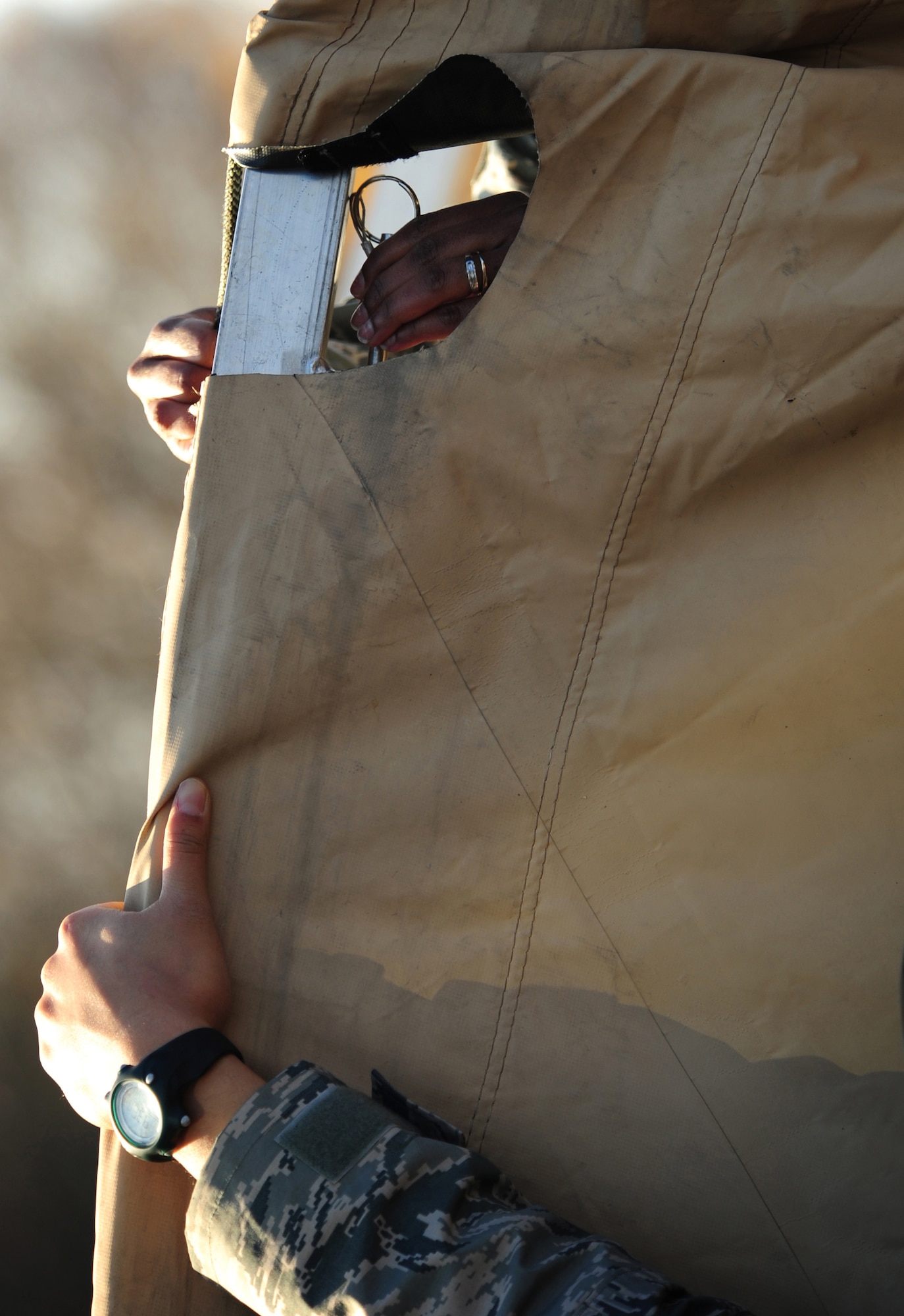 U.S. Air Force Airmen, erect a tent during a practical application exercise portion of Silver Flag, Ramstein Air Base, Germany, Nov. 20, 2010. Silver Flag is a weeklong, ongoing training program that invites Airmen from all over the planet to participate. Members of NATO forces have also been invited to attend. Silver Flag combines classroom and practical application exercises to prepare Airmen for deployment. (U.S. Air Force Photo by Tech Sgt. Jocelyn Rich)