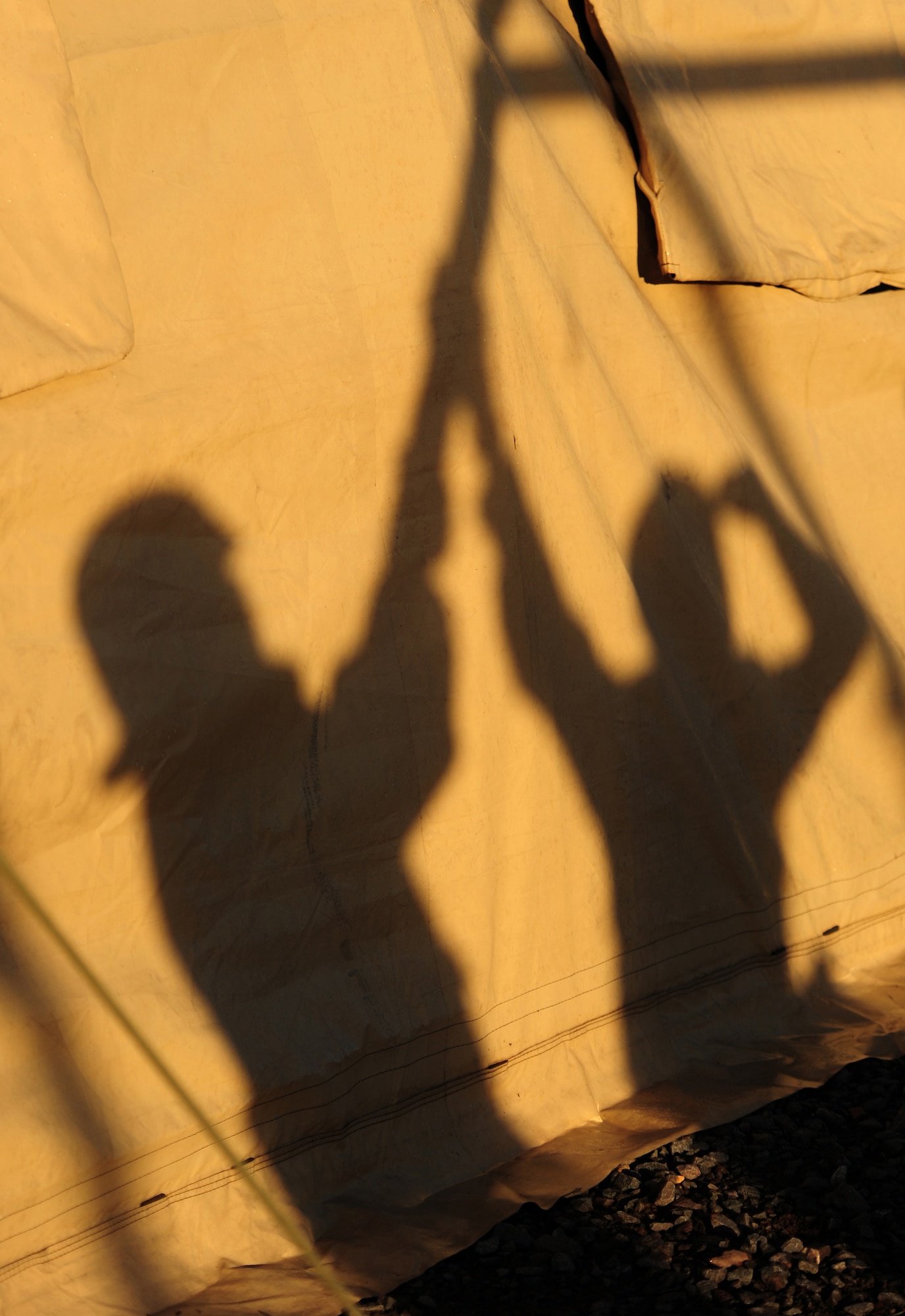 U.S. Air Force Airmen, erect a tent during a practical application exercise portion of Silver Flag, Ramstein Air Base, Germany, Nov. 20, 2010. Silver Flag is a weeklong, ongoing training program that invites Airmen from all over the planet to participate. Members of NATO forces have also been invited to attend. Silver Flag combines classroom and practical application exercises to prepare Airmen for deployment. (U.S. Air Force Photo by Tech Sgt. Jocelyn Rich)