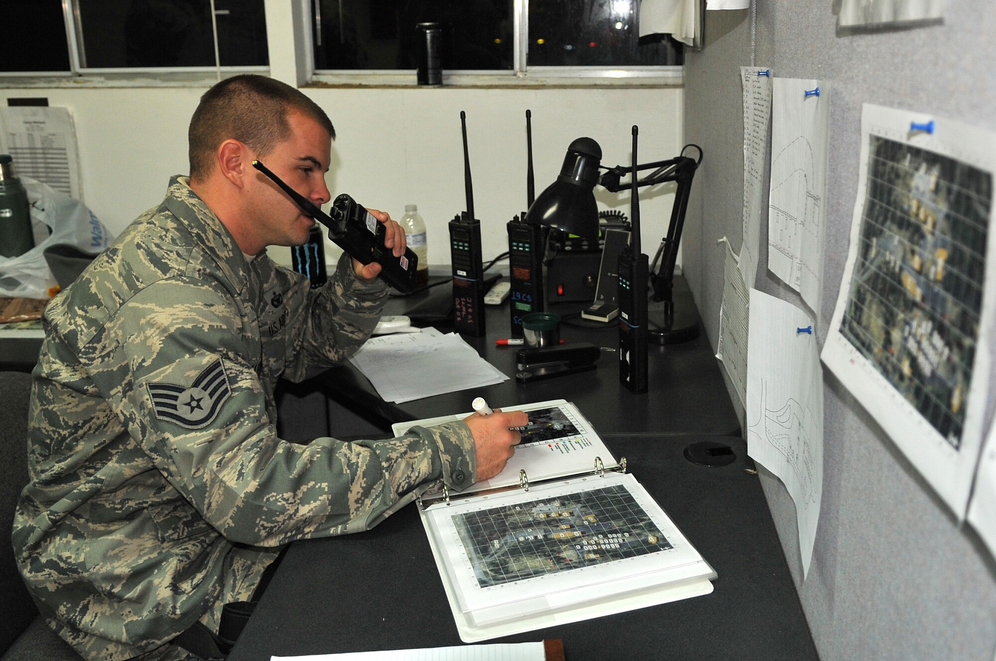 Staff Sgt. Kerry Masterson, a 19th Security Forces controller, calls in dispatches from his deployed operations center Nov. 17, 2010, during the RockEx exercise at Little Rock Air Force Base, Ark. Camp Warlord gives Team Little Rock members a chance to practice deployed operations in a simulated location. (U.S. Air Force photo by Staff Sgt. Chris Willis)