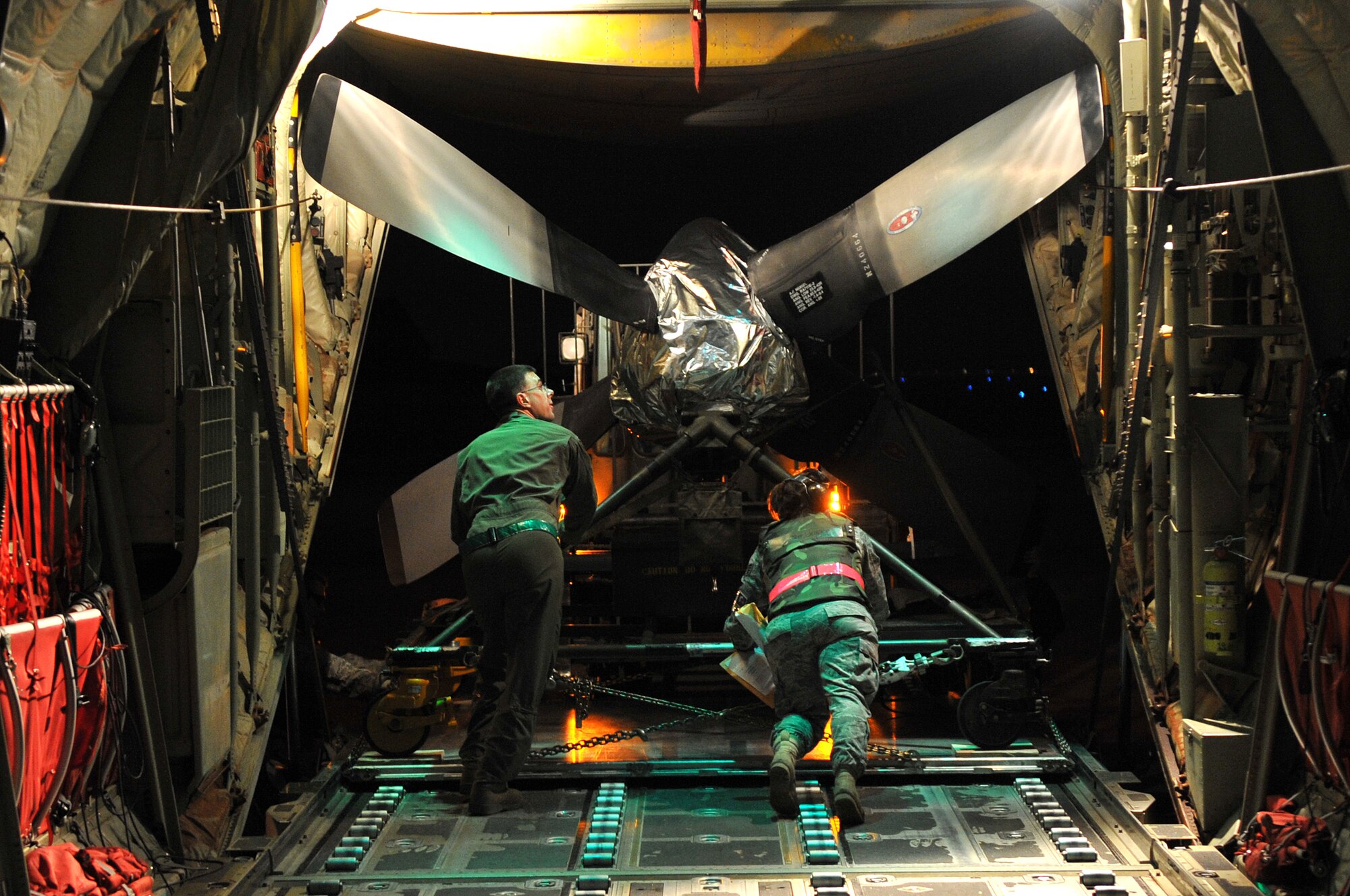Team Little Rock Members unload a C-130H propeller off a C-130J aircraft during the 19th Airlift Wing's Phase 1 Operational Readiness Exercise Nov. 17, 2010, at Little Rock Air Force Base, Ark. The exercise tested the wing's mobility procedures and served as a tune-up for its upcoming Operational Readiness Inspection. (U.S. Air Force photo by Staff Sgt. Chris Willis)