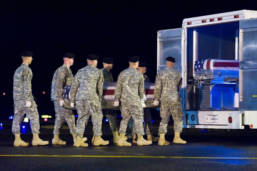 A U.S. Army carry team transfers the remains of Army Pfc. Christian M. Warriner, of Mills River, N.C., at Dover Air Force Base, Del., Nov. 16, 2010. Warriner was assigned to the 1st Battalion, 327th Infantry Regiment, 1st Brigade Combat Team, 101st Airborne Division (Air Assault), Fort Campbell, Ky. (U.S. Air Force photo/Roland Balik)