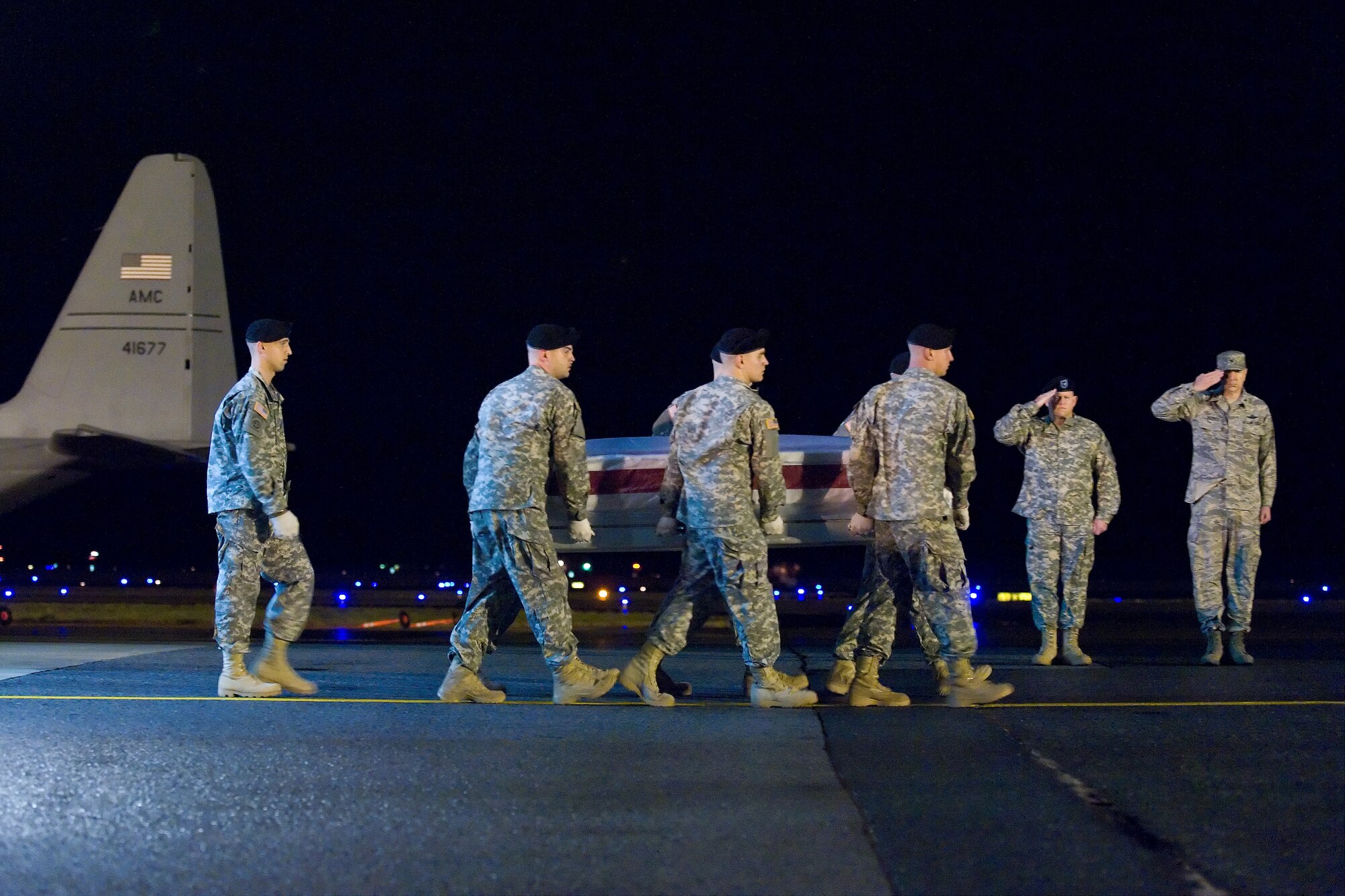A U.S. Army carry team transfers the remains of Army Spc. Jesse A. Snow, of Fairborn, Ohio, at Dover Air Force Base, Del., Nov. 16, 2010. Snow was assigned to the 1st Battalion, 327th Infantry Regiment, 1st Brigade Combat Team, 101st Airborne Division (Air Assault), Fort Campbell, Ky. (U.S. Air Force photo/Roland Balik)