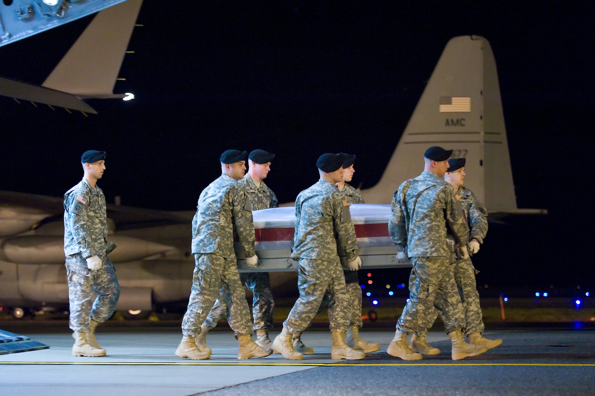 A U.S. Army carry team transfers the remains of Army Staff Sgt. David P. Senft, of Grass Valley, Calif., at Dover Air Force Base, Del., Nov. 16, 2010. He was assigned to the 5th Battalion, 101st Aviation Regiment, 101st Combat Aviation Brigade, 101st Airborne Division (Air Assault), Fort Campbell, Ky. (U.S. Air Force photo/Roland Balik)