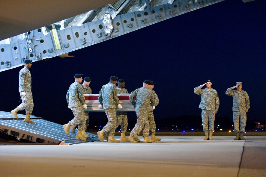 A U.S. Army carry team transfers the remains of Army Sgt. Edward H. Bolen, of Chittenango, N.Y., at Dover Air Force Base, Del., Nov. 12, 2010. He was assigned to the 2nd Battalion, 30th Infantry Regiment, 4th Brigade Combat Team, 10th Mountain Division (Light Infantry), Fort Polk, La. (U.S. Air Force photo/Roland Balik)
