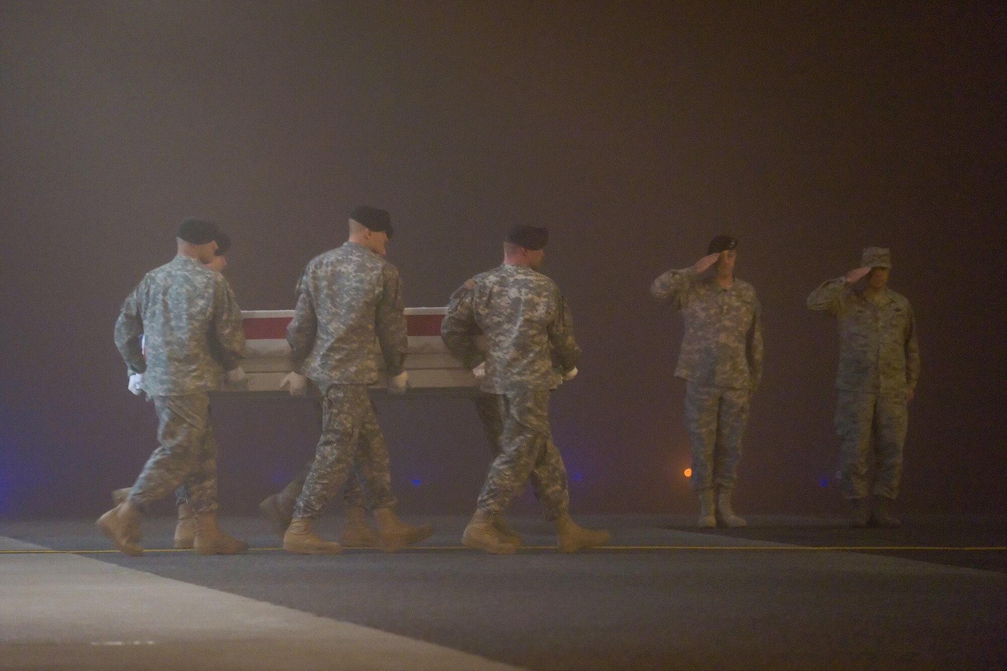 A U.S. Army carry team transfers the remains of Army Pfc. Jacob C. Carroll, of High Point, N.C., at Dover Air Force Base, Del., Nov. 15, 2010. He was assigned to the 2nd Battalion, 502nd Infantry Regiment, 2nd Brigade Combat Team, 101st Airborne Division (Air Assault), Fort Campbell, Ky. (U.S. Air Force photo/Roland Balik)