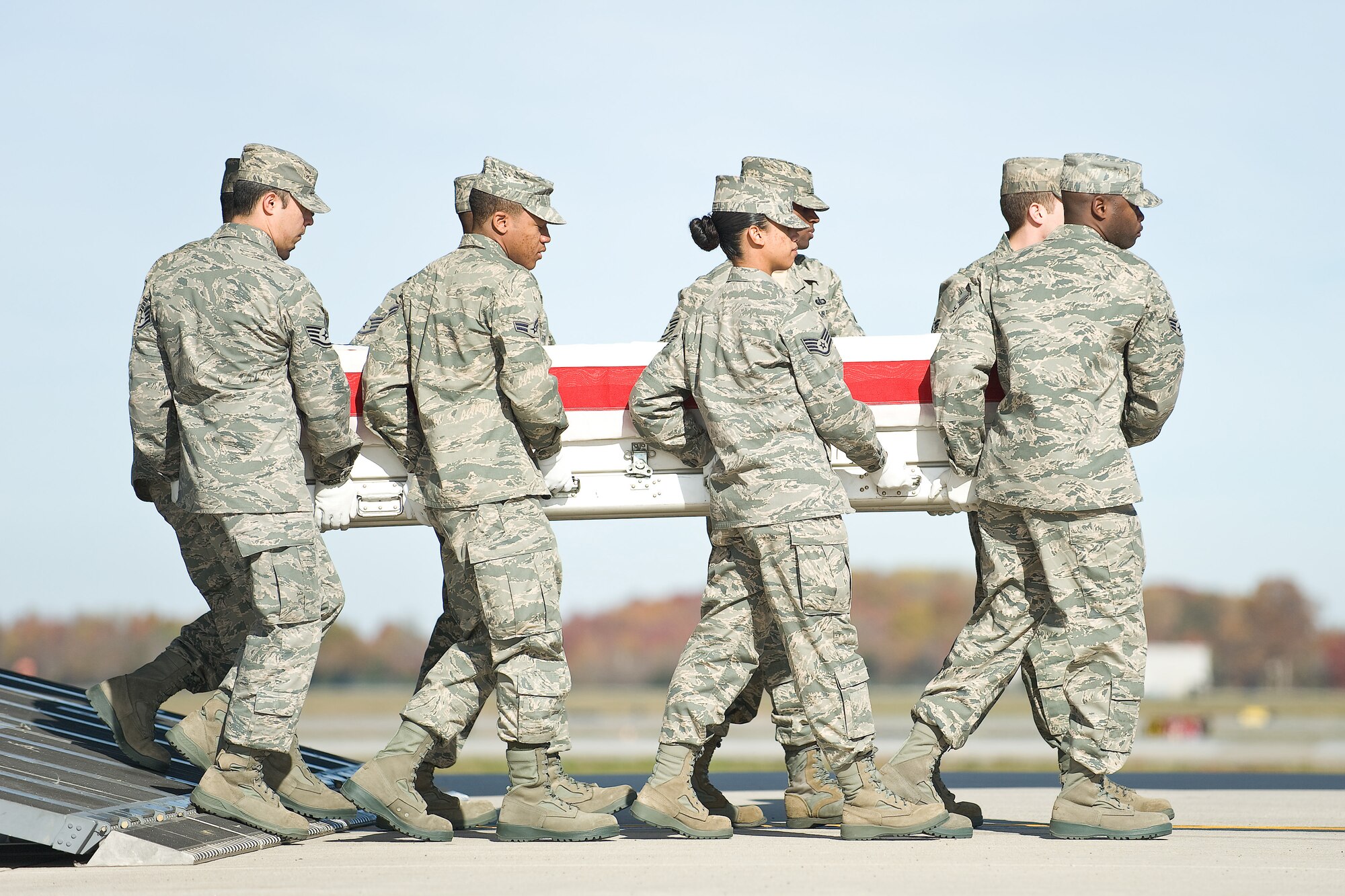 A U.S. Air Force carry team transfers the remains of Air Force Senior Airman Andrew S. Bubacz, of Dalzell, S.C., at Dover Air Force Base, Del., Nov. 14, 2010. Bubacz was assigned to the 97th Communications Squadron, Altus Air Force Base, Okla. (U.S. Air Force photo/Roland Balik)