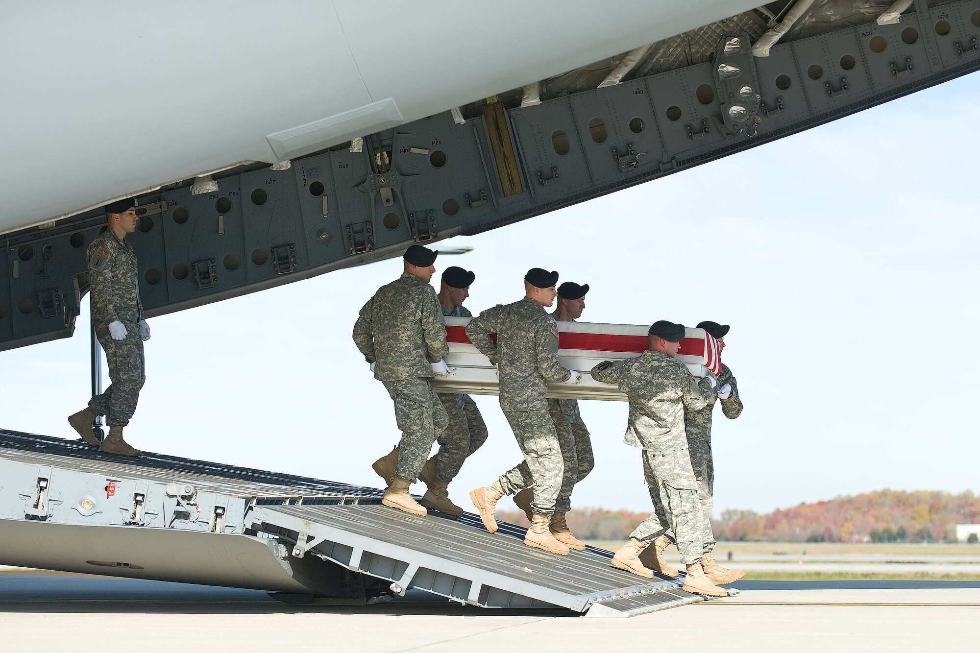 A U.S. Army carry team transfers the remains of Army Spc. Shannon Chihuahua, of Thomasville, Ga., at Dover Air Force Base, Del., Nov. 14, 2010. Chihuahua was assigned to the 1st Battalion, 327th Infantry Regiment, 1st Brigade Combat Team, 101st Airborne Division (Air Assault), Fort Campbell, Ky. (U.S. Air Force photo/Roland Balik)