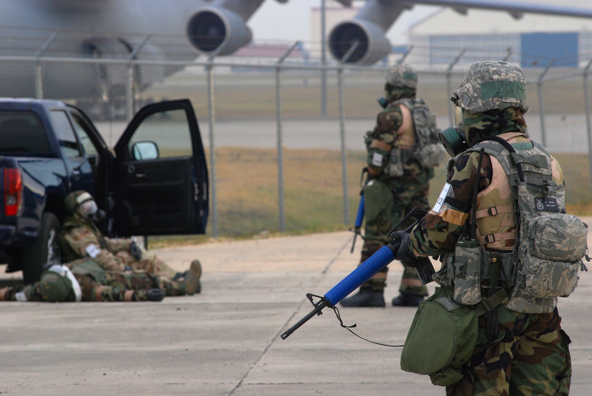 Alamo Wing Airmen were tested during the operational readiness exercise, November 2010, at Lackland Air Force Base, Texas, on disaster and attack preparedness under different conditions and different force protection protocols. Tech. Sgt. Raymond Ervin, and other members of the 433rd Security Forces Squadron, examine a simulated crash. (U.S. Air Force photo/Airman 1st Class Brian McGloin)