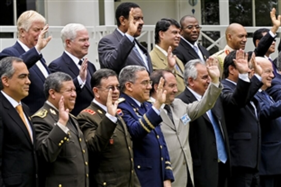 U.S. Defense Secretary Robert M. Gates, top row, second from left, poses for a group photo during a conference for Western Hemisphere defense ministers in Santa Cruz, Bolivia, Nov. 21, 2010.