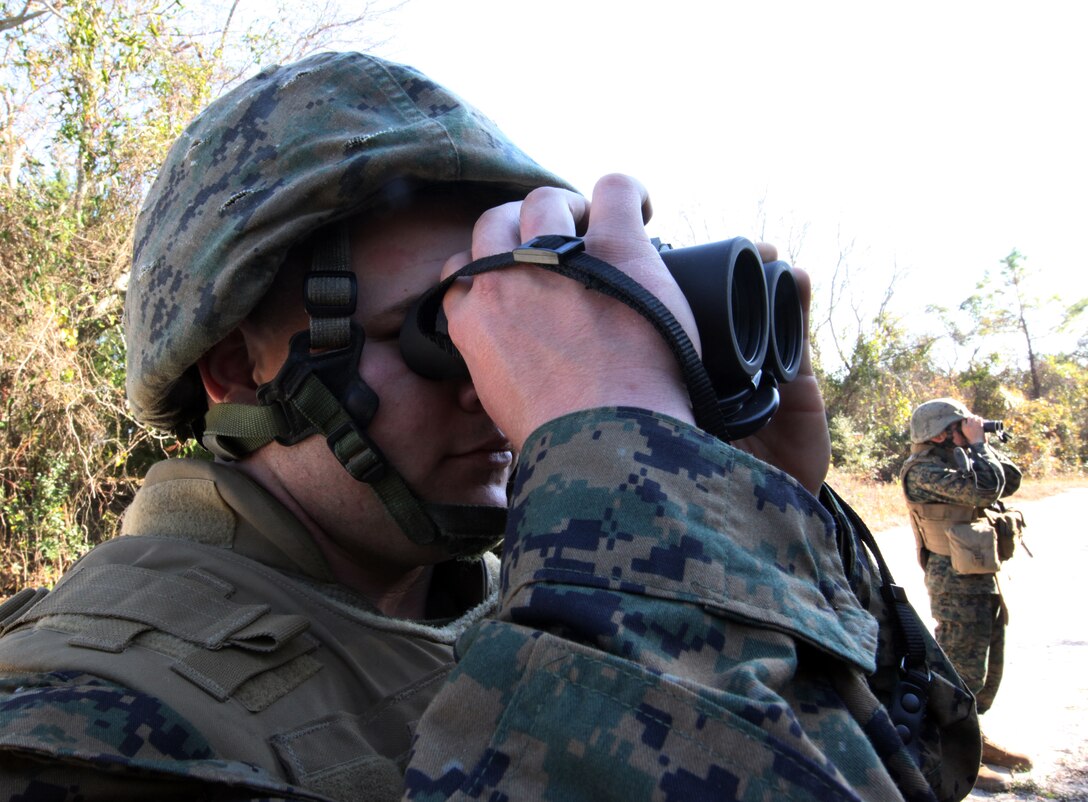 Lance Cpl. Shayne Bierly, a generator mechanic with Combat Logistics Battalion 6, Combat Logistics Regiment 2, 2nd Marine Logistics Group, tries to spot improvise explosive device indicators during a counter IED training exercise aboard Camp Lejeune, N.C., Nov. 23, 2010. The training taught Marines the common signs of an IED and how to spot them in different scenarios. (U.S. Marine Corps photo by Pfc. Franklin E. Mercado)