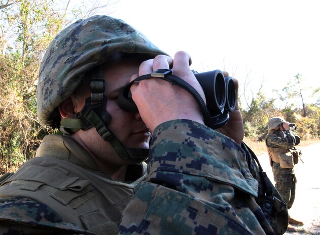 Lance Cpl. Shayne Bierly, a generator mechanic with Combat Logistics Battalion 6, Combat Logistics Regiment 2, 2nd Marine Logistics Group, tries to spot improvise explosive device indicators during a counter IED training exercise aboard Camp Lejeune, N.C., Nov. 23, 2010. The training taught Marines the common signs of an IED and how to spot them in different scenarios. (U.S. Marine Corps photo by Pfc. Franklin E. Mercado)