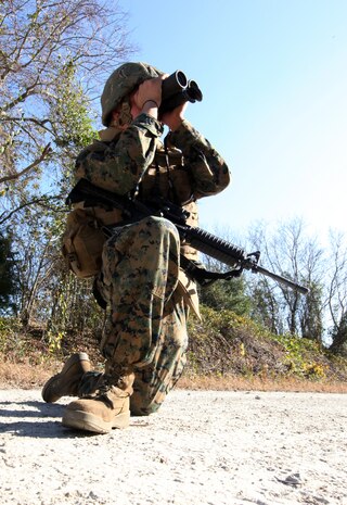 Lance Cpl. Deven Rafter, a supply clerk with Combat Logistics Battalion 6, Combat Logistics Regiment 2, 2nd Marine Logistics Group, tries to spot improvise explosive device indicators during a counter IED training exercise aboard Camp Lejeune, N.C., Nov. 23, 2010. The training taught Marines the common signs of an IED and how to spot them in different scenarios. (U.S. Marine Corps photo by Pfc. Franklin E. Mercado)