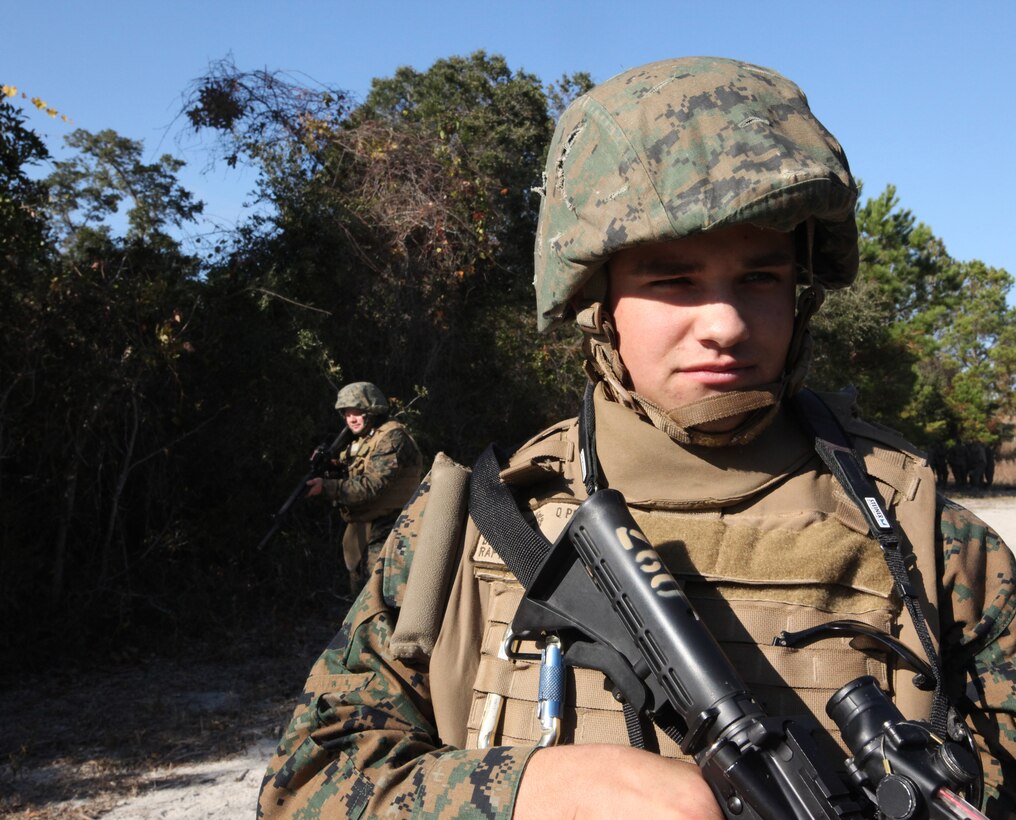 Lance Cpl. Deven Rafter, a supply clerk with Combat Logistics Battalion 6, Combat Logistics Regiment 2, 2nd Marine Logistics Group, conducts a patrol during a counter improvised explosive device training exercise aboard Camp Lejeune, N.C., Nov. 23, 2010. The training taught Marines the common signs of an IED and how to spot them in different scenarios. (U.S. Marine Corps photo by Pfc. Franklin E. Mercado)