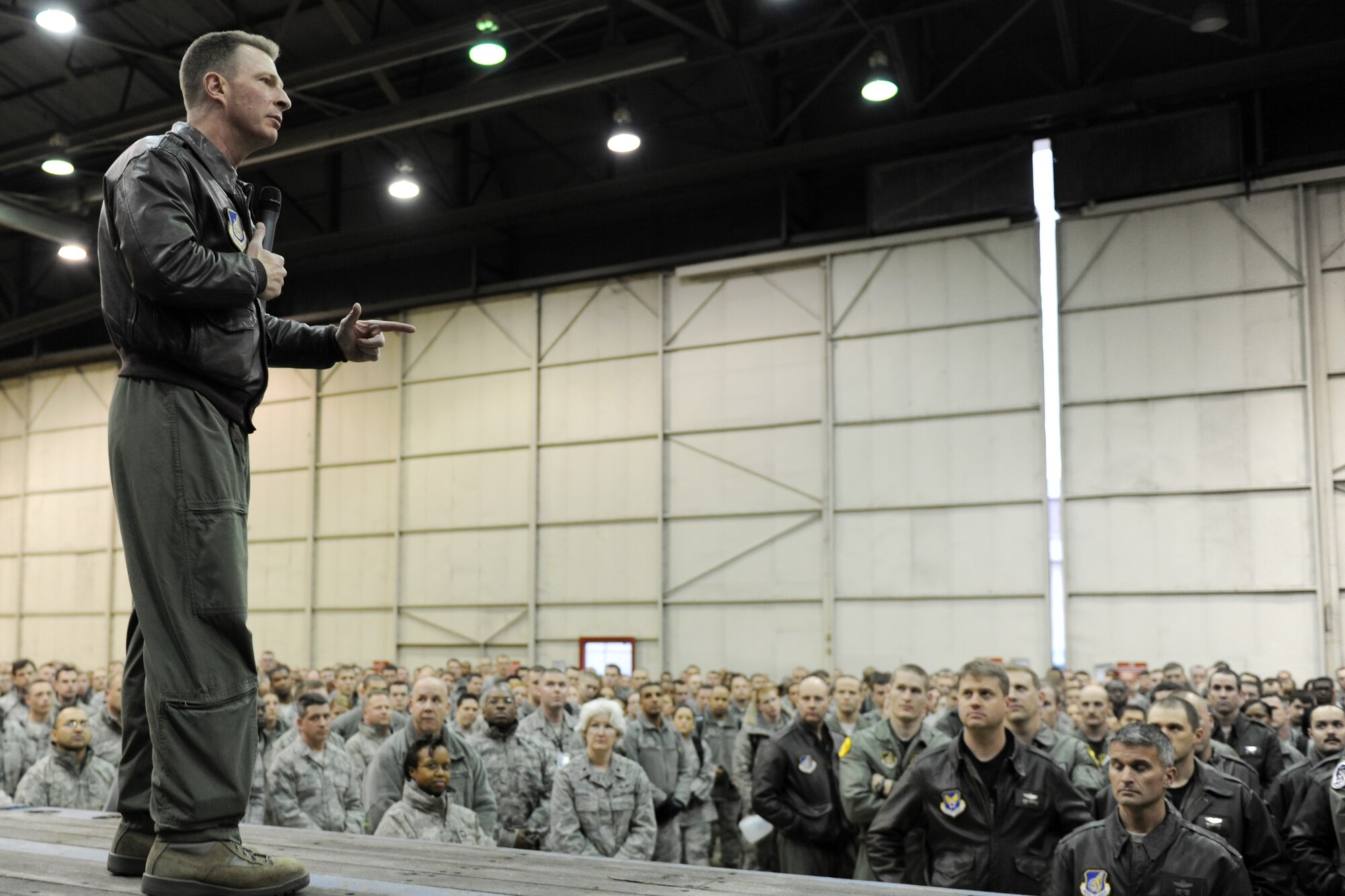 KUNSAN AIR BASE, Republic of Korea -- Col. John Dolan, 8th Fighter Wing commander, addresses base Airmen during a commander's call regarding the overall wing grade during a no notice readiness inspection in Hangar 3 Nov. 23.  The wing participated in the Phase 1 operational readiness inspection Beverly Bearcat 10-06 that tested the wing's prepartion and mobilization from peacetime readiness into wartime posture. (U.S. Air Force photo/Staff Sgt. Jonathan Pomeroy)
