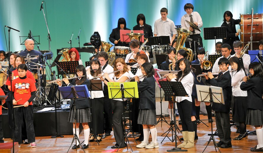 AKISHIMA, Japan -- All participants gather on stage for a joint performance Nov. 23 during the Japan-U.S. Joint concert in Akishima city. North Kanto Defense Bureau hosted the Japan-U.S. Joint Concert to enhance bilateral relations between U.S. service members, dependents and neighbors of Yokota Air Base. (U.S. Air Force photo/Osakabe Yasuo)