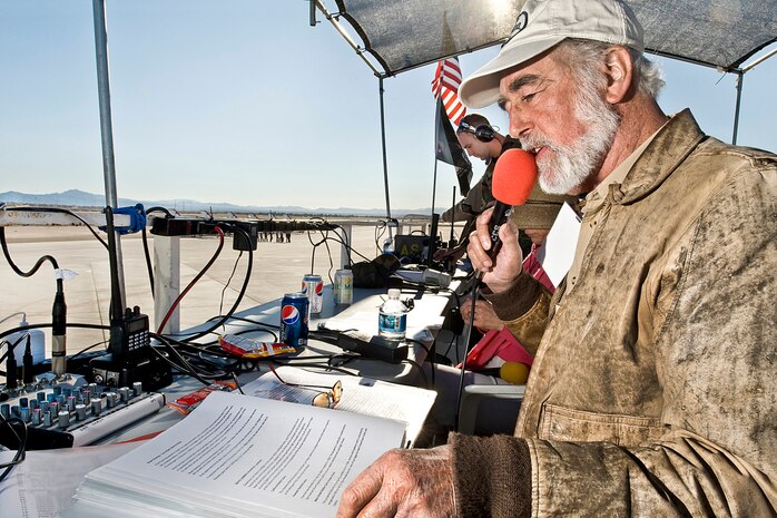 NELLIS AIR FORCE BASE, Nev.-- Gordon Bowman-Jones, the voice of the 2010 Aviation Nation Nellis Open House, introduces the U.S. Air Force Air Demonstration Squadron 'Thunderbirds' prior to their performance on Nov. 14.  Mr. Bowman-Jones has narrated more than 7,000 air shows and next year will mark his 40th anniversary as an air show announcer. (U.S. Air Force photo/ Lawrence Crespo) 






