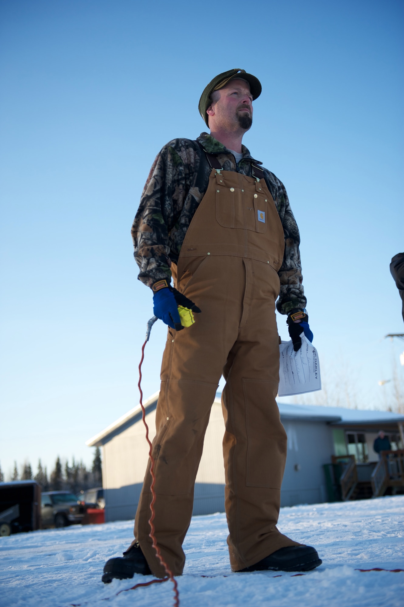 Zach Million, Joint Base Elmendorf-Richardson Skeet and Trap Range recreation assistant, operates a remote target release during the Nov. 20 turkey shoot. (Photo by David Bedard/JBER PAO)