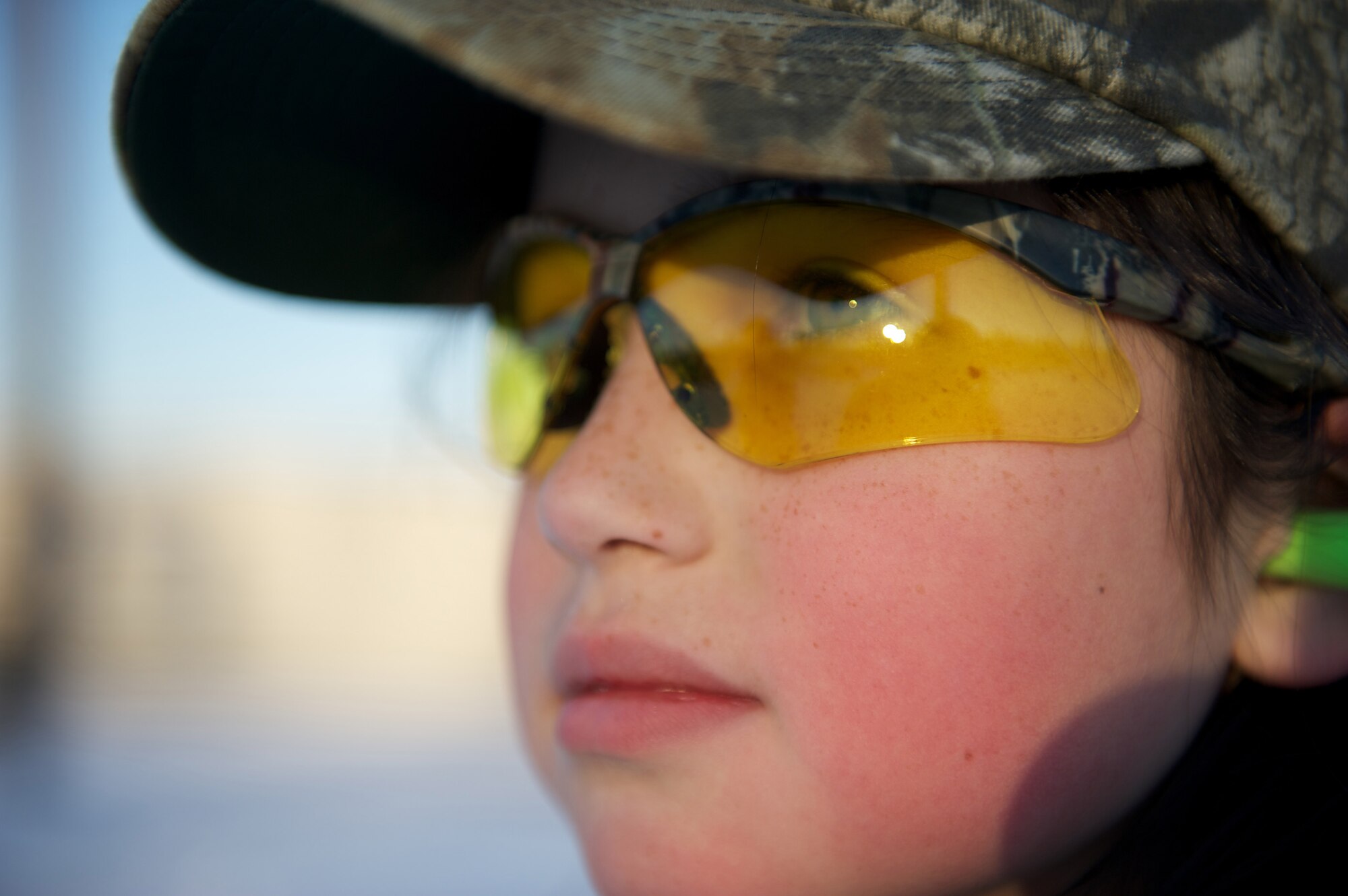 Jasmine Katchur, 10, of Cottonwood Creek Elementary School, keeps a sharp eye during the Nov. 20 Joint Base Elmendorf-Richardson Skeet and Trap Range turkey shoot. (Photo by David Bedard/JBER PAO)