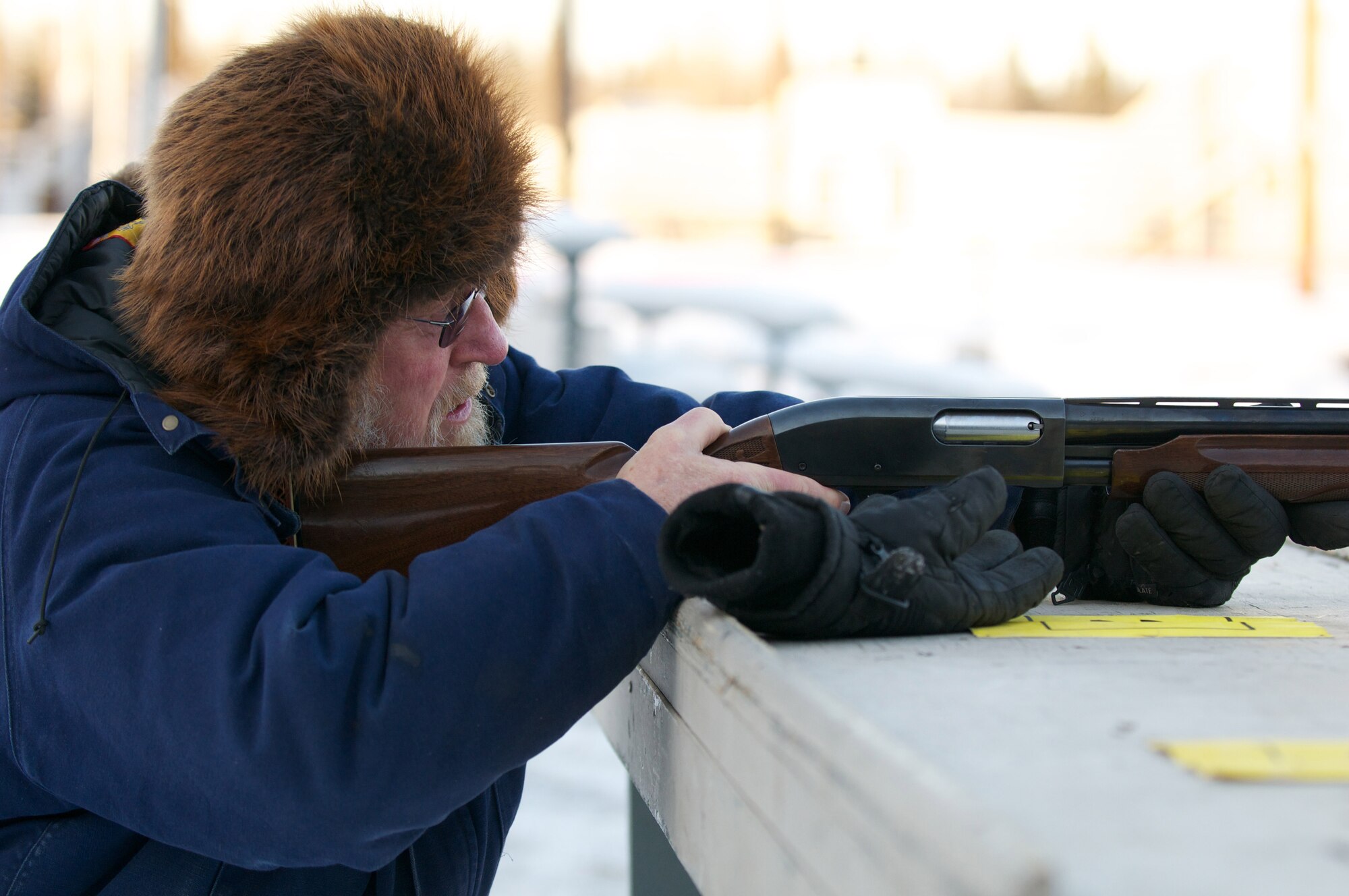 Emmet Heidemann, Alaska Military Retiree Council, shoots splatter board as part of the JBER turkey shoot, Nov. 20. (Photo by David Bedard/JBER PAO)
