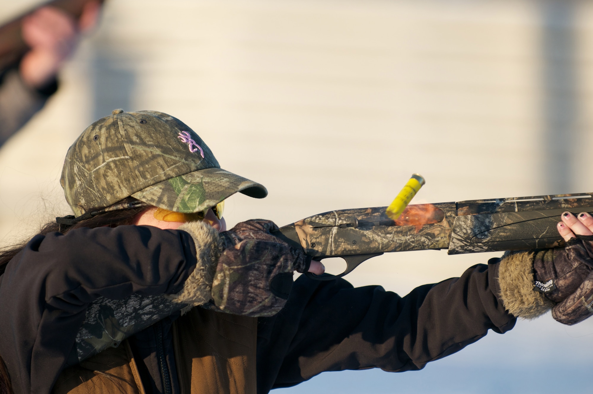 Jasmine Katchur, 10, of Cottonwood Creek Elementary School, shoots a 12-gauge shotgun in an Annie Oakley competition during the Nov. 20 Joint Base Elmendorf-Richardson Skeet and Trap Range turkey shoot. (Photo by David Bedard/JBER PAO)